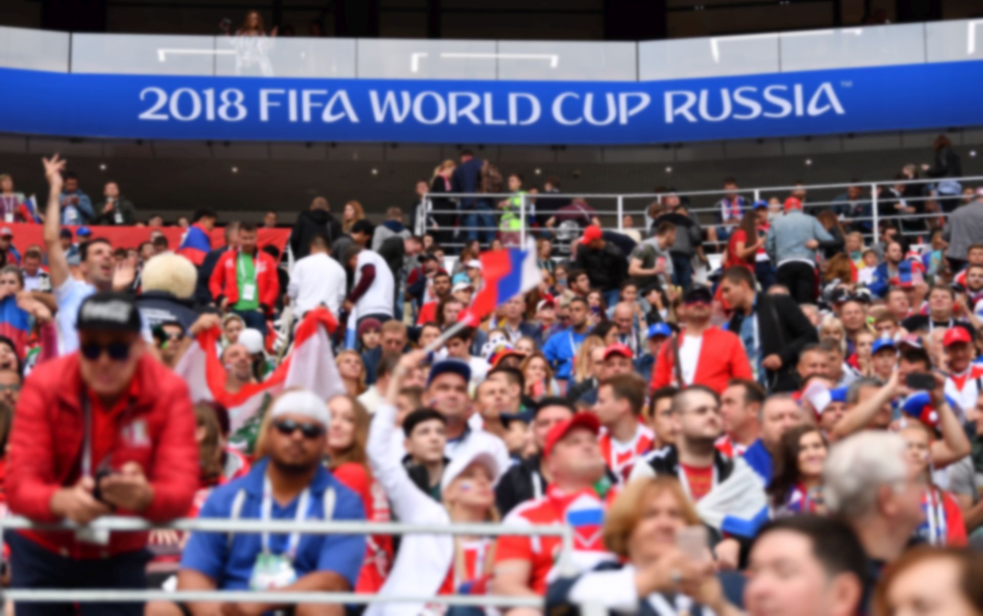 epa06807329 Fans wait for the start of the FIFA World Cup 2018 group A preliminary round soccer match between Russia and Saudi Arabia in Moscow, Russia, 14 June 2018.

(RESTRICTIONS APPLY: Editorial Use Only, not used in association with any commercial entity - Images must not be used in any form of alert service or push service of any kind including via mobile alert services, downloads to mobile devices or MMS messaging - Images must appear as still images and must not emulate match action video footage - No alteration is made to, and no text or image is superimposed over, any published image which: (a) intentionally obscures or removes a sponsor identification image; or (b) adds or overlays the commercial identification of any third party which is not officially associated with the FIFA World Cup)  EPA/PETER POWELL   EDITORIAL USE ONLY  EDITORIAL USE ONLY