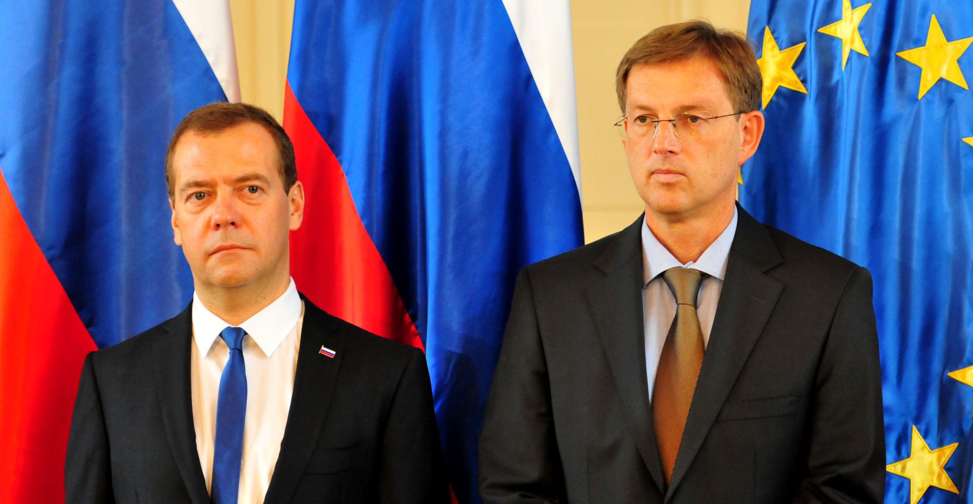 epa04862507 Russian Prime Minister Dmitry Medvedev (L) and Slovenian Prime Minister Miroslav Cerar (R) deliver a press conference in Ljubljana, Slovenia, 27 July 2015. Medvedev is on a two-day visit to Slovenia.  EPA/IGOR KUPLJENIK