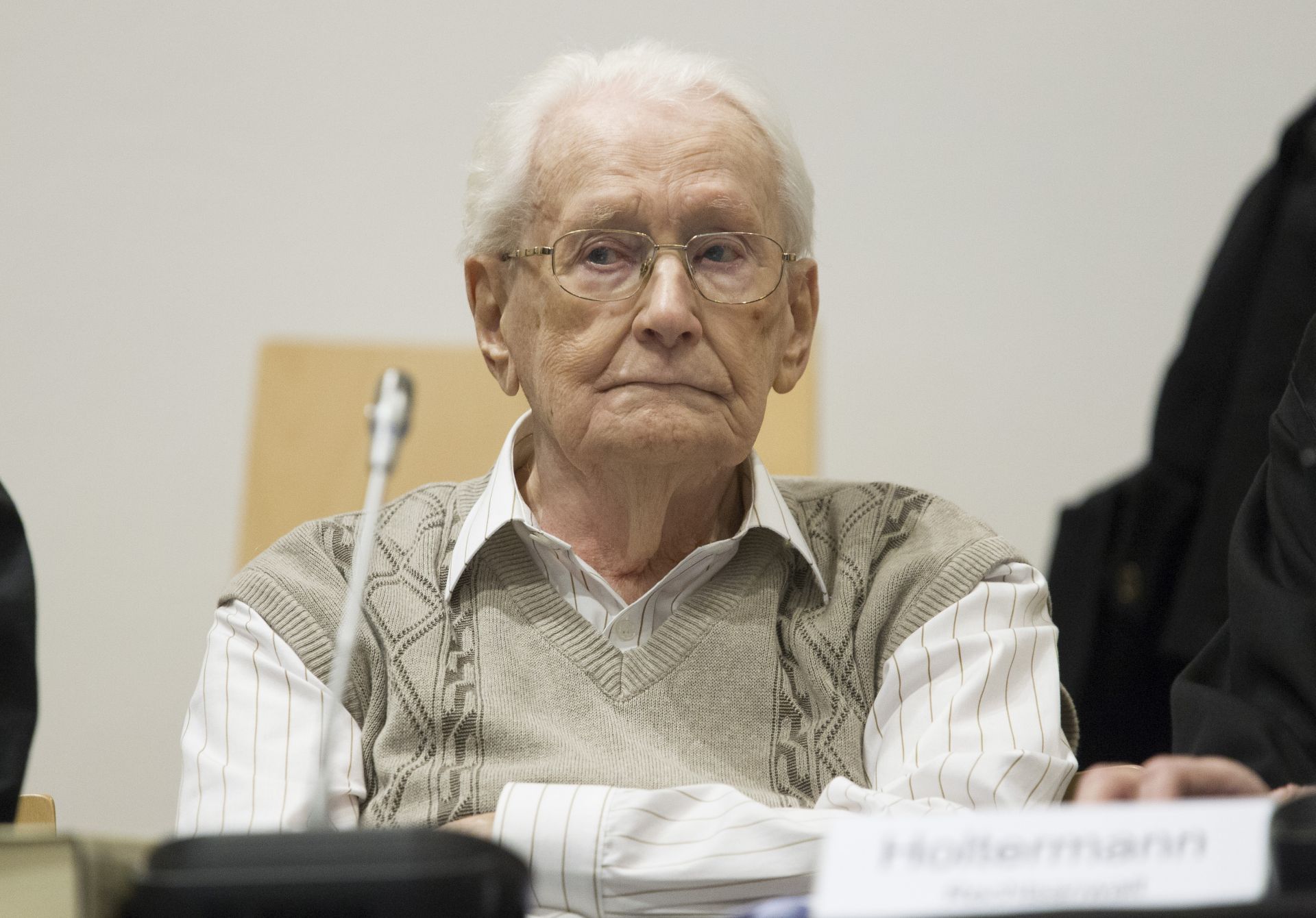 LUNEBURG, GERMANY - 21 APRIL:  Oskar Groening, 93, arrives for the first day of his trial to face charges of being accomplice to the murder of 300,000 people at the Auschwitz concentration camp on April 21, 2015 in Lueneburg, Germany. Groening was an accountant with the Waffen SS and has been open about his role, claiming in interviews with media that he accepts his moral responsibility. Groening has also written an account of his experience, in what he claims is an effort to counter Holocaust revisionists. State prosecutors accuse Groening of accomplice in the murder of 300,000 Hungarian Jews who arrived at Auschwitz in 1944.  (Photo by Andreas Tamme - Pool/Getty Images)