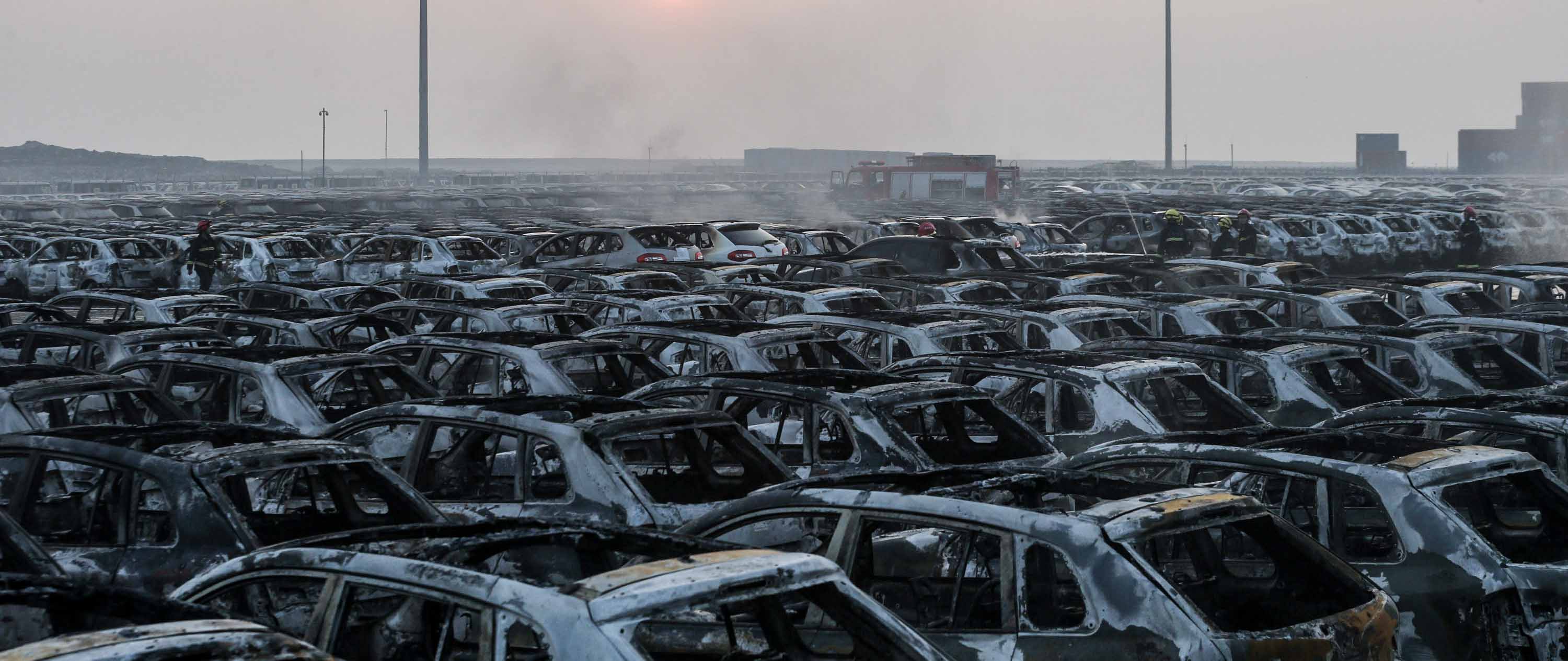 TIANJIN, CHINA - AUGUST 13: (CHINA OUT) Burnt cars are seen in the debris following the explosions of a warehouse in Binhai New Area on August 13, 2015 in Tianjin, China. At least 17 people dead, 32 are in critical condition and at least another 400 injured during the explosions of a warehouse on late Wednesday in Binhai New Area in Tianjin, according to police authority.  (Photo by ChinaFotoPress/ChinaFotoPress via Getty Images)