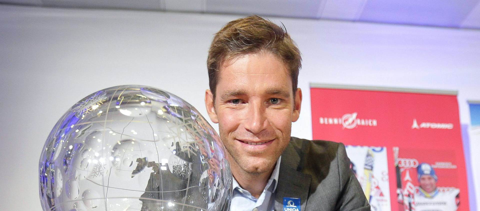 epa04923692 Austrian skier Benjamin Raich poses with his Overall World Cup trophy and his Olympic gold medals during a press conference in Vienna, Austria, 10 September 2015. Two-time Olympic champion Benjamin Raich announced his retirement, ending a career of 19 years as professional alpine ski racer. Raich won 14 medals at Olympic Games and World Championships, including two gold in the Slalom and Giant Slalom races of the Turin 2006 Winter Olympic Games and two gold at the 2005 World Championships in Bormio. He took the overall World Cup trophy in 2006 and won 36 World Cup races.  EPA/GEORG HOCHMUTH