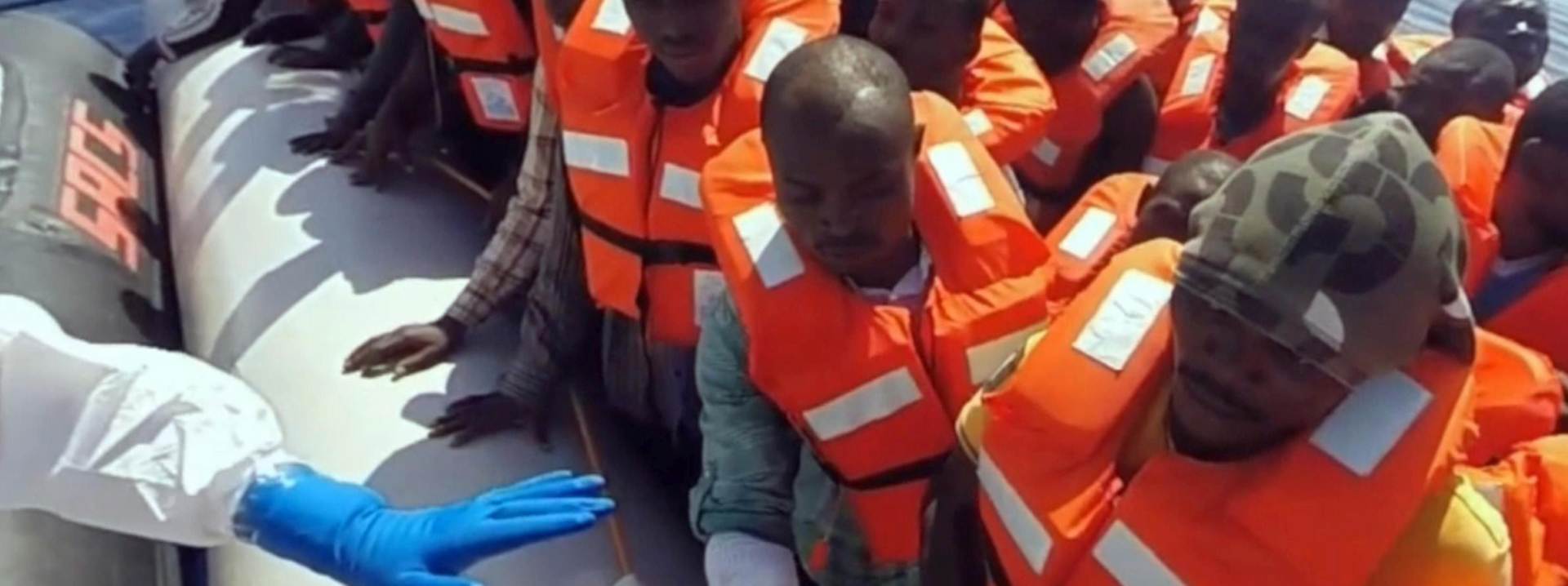 epa04940024 A handout photoreleased by the Italian Coast Guard (Guardia Costiere) on 20 September 2015 is a still grab from a video taken during an operation in the Mediterranean Sea as the Coast Guard in which they rescue 130 migrants at sea on 19 September 2015. Media reports say that around 4,700 migrants were rescued in different operation on Mediterranean Sea on Saturday, 19 September 2015. (ATTENTION EDITORS: Editorial use only in connection with reporting on the events depicted in the image)  EPA/GUARDIA COSTIERA/HANDOUT  HANDOUT EDITORIAL USE ONLY/NO SALES