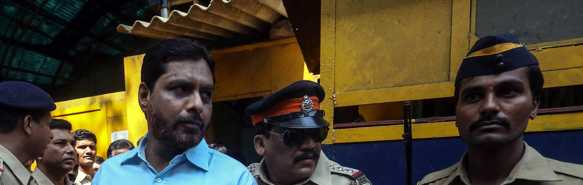 epa04956811 Indian police officers escort a man accused of being involved in Mumbai's serial bombings of commuter trains in 2006, at Arthur Road Jail in Mumbai, India, 30 September 2015. An Indian court sentenced five men to death on 30 September 2015 for the multiple blasts on Mumbai's local trains in 2006 that killed 189 people, lawyers said. A total of 12 accused were found guilty of murder and criminal conspiracy among other charges by special judge YD Shinde two weeks ago. Four other convicts were given life in prison while the remaining three were given varying jail terms, said Gulzar Azmi, representative of the organization providing legal aid to the accused. Azmi said the decision would be challenged in a higher court. The men given death sentences were those who had planted the bombs on Mumbai's busy rail network, India Today television reported. The coordinated blasts in India's financial hub on 11 July 2006 also left over 800 injured. Indian investigators alleged that Pakistan's Inter-Services Intelligence agency planned the blasts and they were carried out by the Pakistan-based Lashkar-e-Taiba group with help from the Students' Islamic Movement of India, a banned group. Pakistan rejected the allegations. Fifteen people accused of involvement in the attacks, including the alleged masterminds, have never been caught.  EPA/DIVYAKANT SOLANKI  EPA/DIVYAKANT SOLANKI