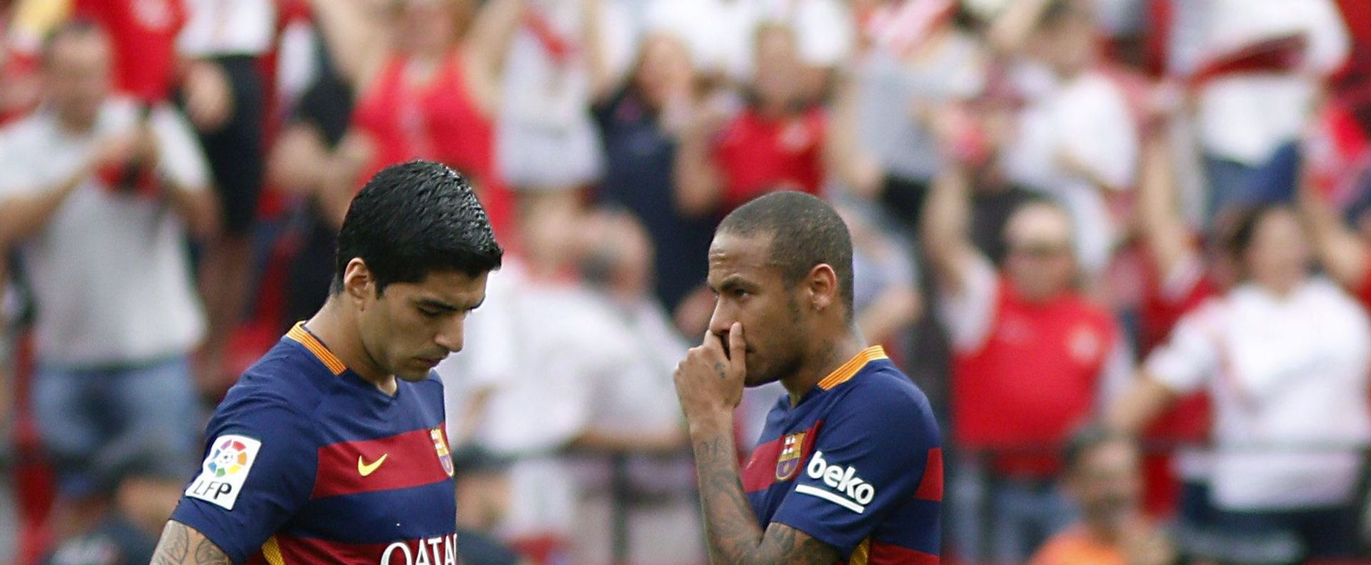 epa04961756 FC Barcelona's players Croatian Ivan Rakitic (L), Uruguayan Luis Suarez (C), and Brazilian Neymar Jr. (R) react after the opening goal of Sevilla CF during the Spanish Liga Primera Division soccer match played at Sanchez Pizjuan stadium, in Sevilla, southern Spain, 03 October 2015.  EPA/JOSE MANUEL VIDAL