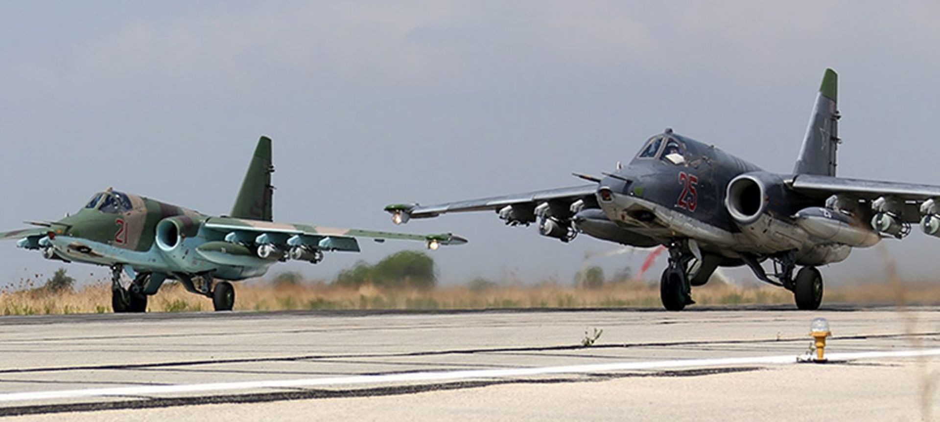 epa04966911 A handout picture dated 03 October 2015 made available on the official website of the Russian Defence Ministry on 06 October 2015 shows two Russian SU-25  strike fighters taking off from the Syrian Hmeymim airbase, outside Latakia, Syria. Russian warplanes involved in carrying out airstrikes against what Russia says terrorist Islamic State (ISIS or IS) facilities is deployed at the Hmeymim airbase.  EPA/RUSSIAN DEFENCE MINISTRY PRESS SERVICE/HANDOUT  HANDOUT EDITORIAL USE ONLY/NO SALES