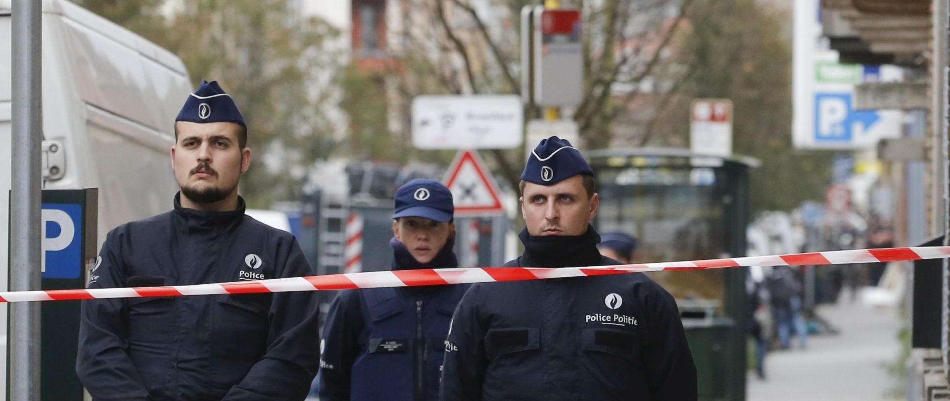 epa05027885 Riot Police stand guard at rue Delaunoy in the streets of Molenbeek, Brussels, Belgium, 16 November 2015. More than 130 people were killed and hundreds injured in the terror attacks which targeted the Bataclan concert hall, the Stade de France national sports stadium, and several restaurants and bars in the French capital on 13 November. Authorities believe that three coordinated teams of terrorists armed with rifles and explosive vests carried out the attacks, which the Islamic State (IS) extremist group has claimed responsibility for.  EPA/OLIVIER HOSLET