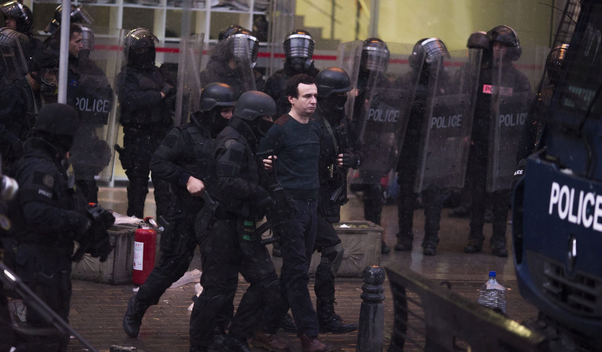 epa05046048 Kosovo police officers arrest Albin Kurti, (C), the opposition lawmaker and one of the opposition leaders after a protest in in Pristina, Kosovo 28 November 2015. Thousands of opposition supporters gathered to protest against the agreements that has been reached during the EU-brokered dialogue with Serbia.  EPA/VALDRIN XHEMAJ