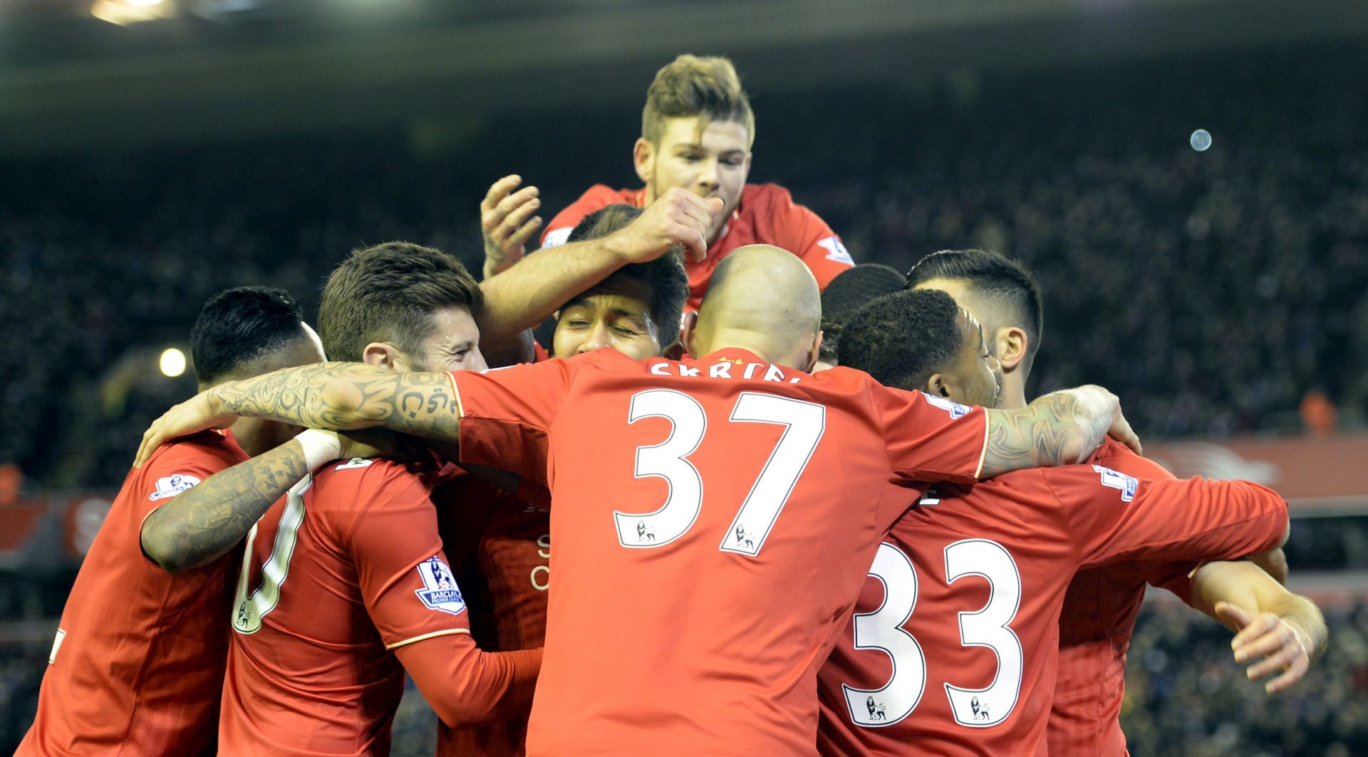 epa05047790 Liverpools James Milner (unseen) scores from the penalty spot to put Liverpool one up and then celebrates with his teamates during the English Premier League soccer match between Liverpool and  Swansea, Britain, 29 November 2015.  EPA/Peter Powell Editorial Use Only.No use with unauthorised audio ,video,data,fixtures list.club/league logos,or live services,online in-match use limited to 75images,no video emulation.no use in betting, games or single club/player publications.