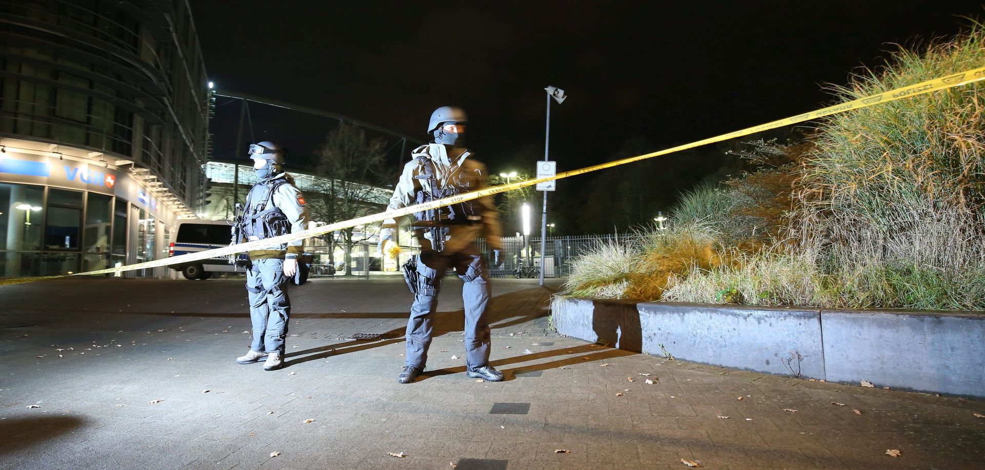 epa05030080 Police outside the HDI-Arena stadium in Hanover, Germany, 17 November 2015.  The match was called off at short notice due to security concerns and the stadium was evacuated.  EPA/CHRISTIAN CHARISIUS