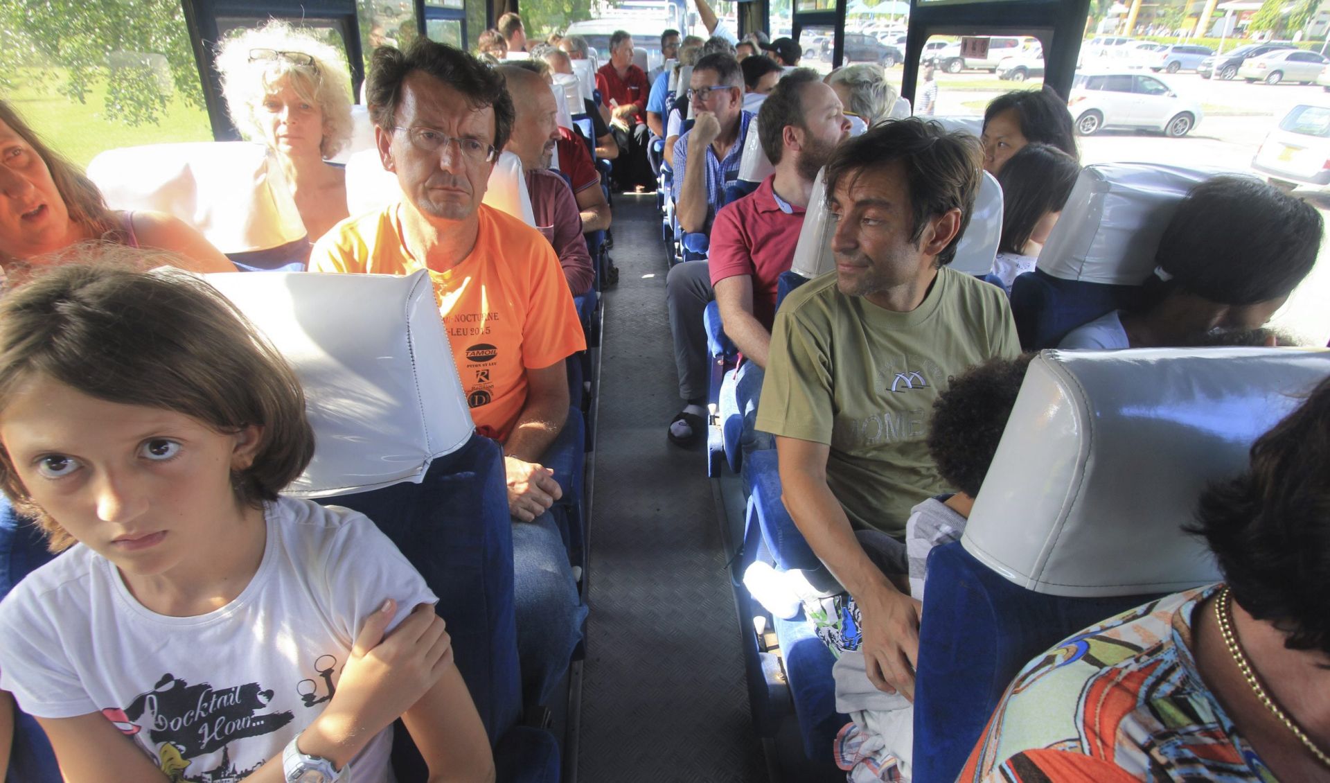 epa05076072 Passengers of Air France flight 463 onboard a bus as they are evacuated after the plane made an emergency landing at Moi International airport in the Kenyan coastal city Mombasa, 20 December 2015. The Boeing 777 Air France flight 463 from Mauritius to Paris was forced to land in Mombasa at 12:37am after a device suspected to be a bomb was found in the lavatory, the Kenyan police spokesman said. All passengers have been safely evacuated and the device is being analyzed, according to the police.  EPA/STR