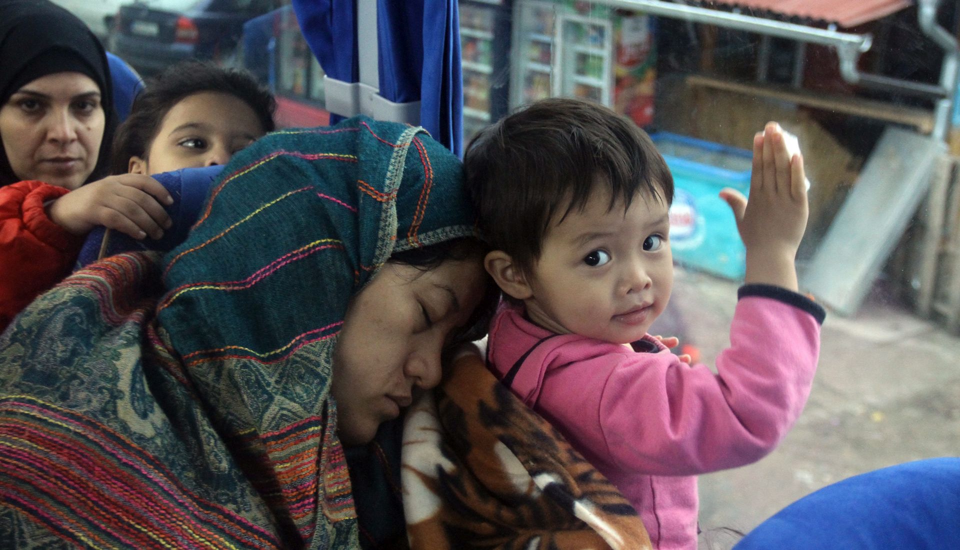 epa05039884 Migrants from Syria, Iraq and Afghanistan are transported by bus to the border between Serbia and Croatian after registration in the registration camp in the town of Presevo, southern Serbia, 24 November 2015. Serbia, among other countries, had started restricting access to the Balkan route, which under new measures is only open to Syrians, Iraqis and Afghans. Hundreds of thousands of people pass through the Balkan route, sailing from Turkey to the Greek Aegean islands, then crossing the mainland, Macedonia, Serbia, Croatia, Slovenia and Austria.  EPA/DJORDJE SAVIC