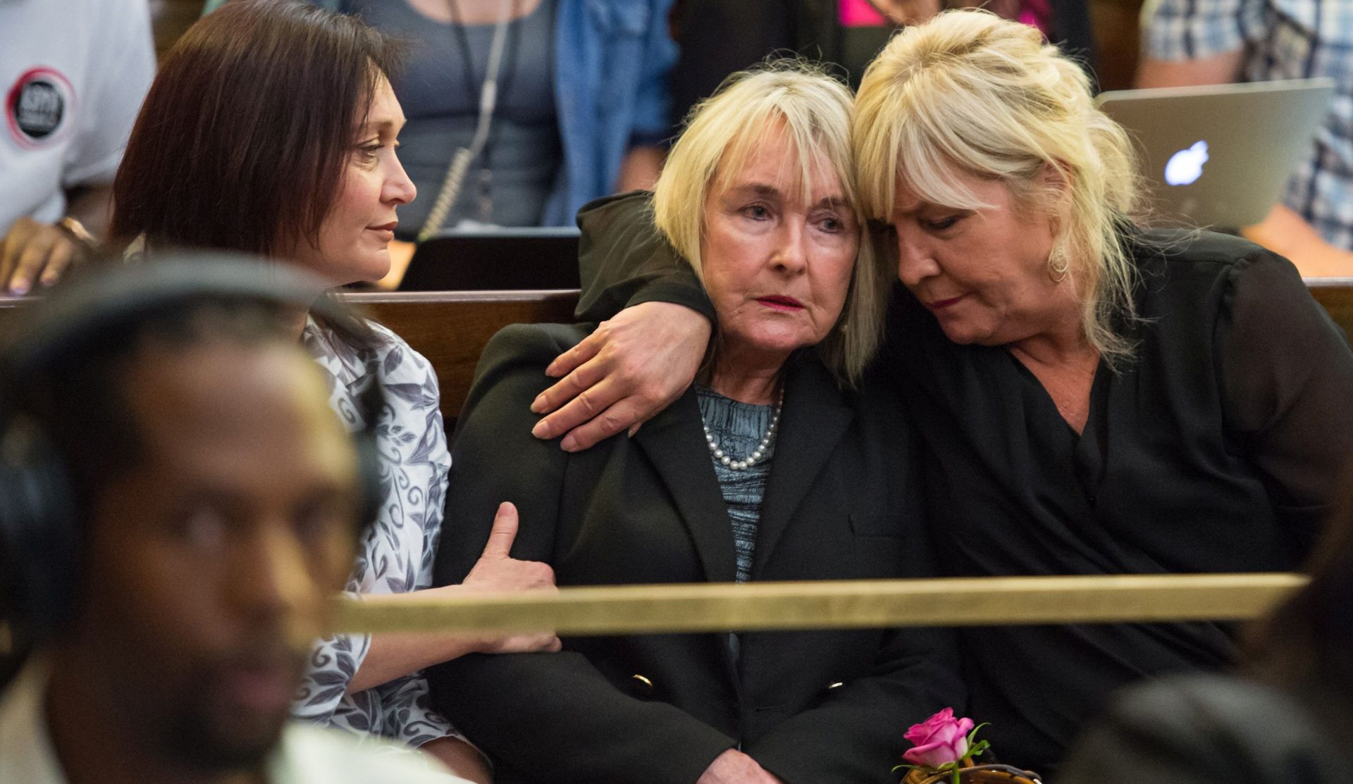 epa05052807  June Steenkamp the mother of Reeve Steenkamp, is embraced by a relative  as appeals court judge Leach finds Oscar Pistorius guilty of murder  in Bloemfontein, South Africa, Dec. 3, 2015.  The Supreme Court of Appeals said the original trial made an error of law in convicting the athlete of culpable homicide for killing his girlfriend Reeva.  EPA/JOHAN PRETORIUS