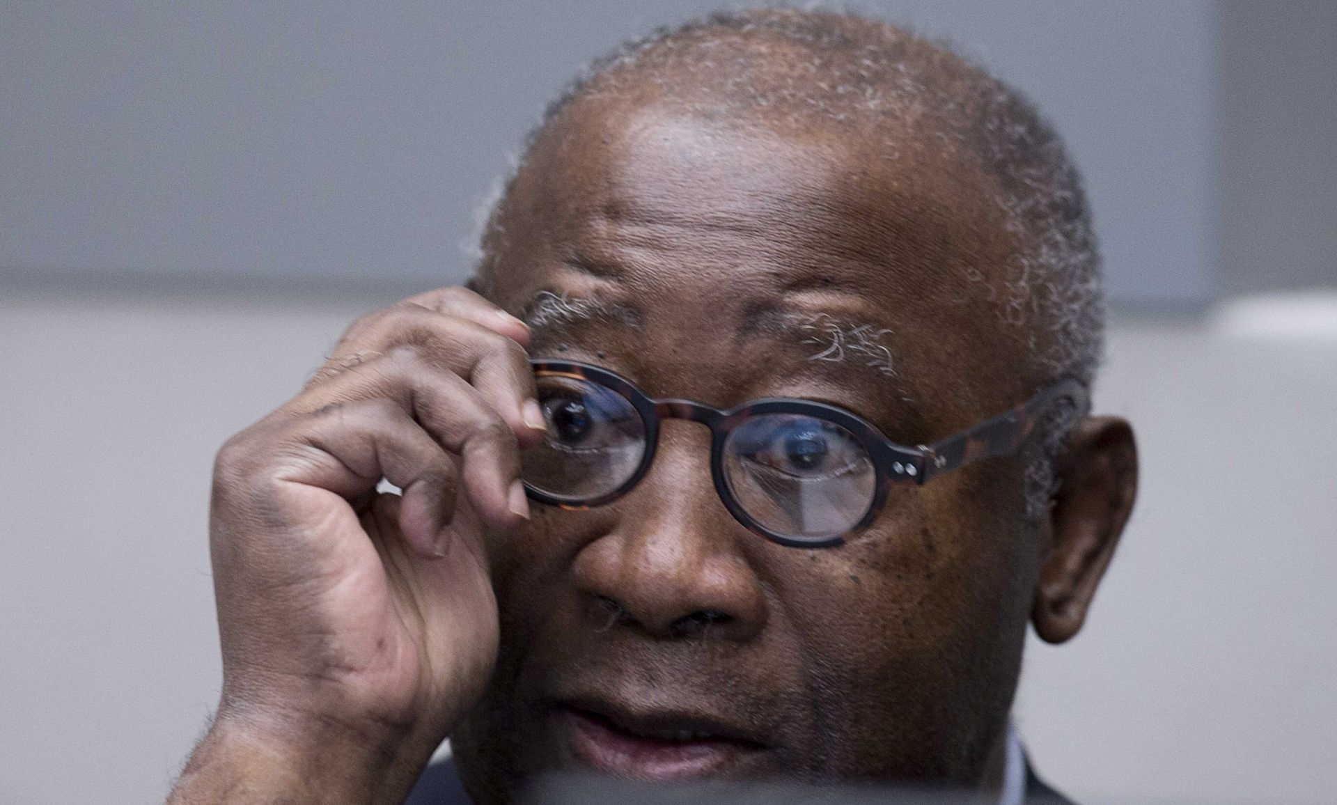 epa05130944 Former Ivory Coast president Laurent Gbagbo waits for the start of his trial at the International Criminal Court in The Hague, Netherlands, 28 January 2016. Gbagbo is in court along with a former youth minister Charles Ble Goude on charges of involvement in violence after 2010 presidential elections that left 3,000 people dead in Ivory Coast, once a haven of stability in West Africa.  EPA/PETER DEJONG / POOL
