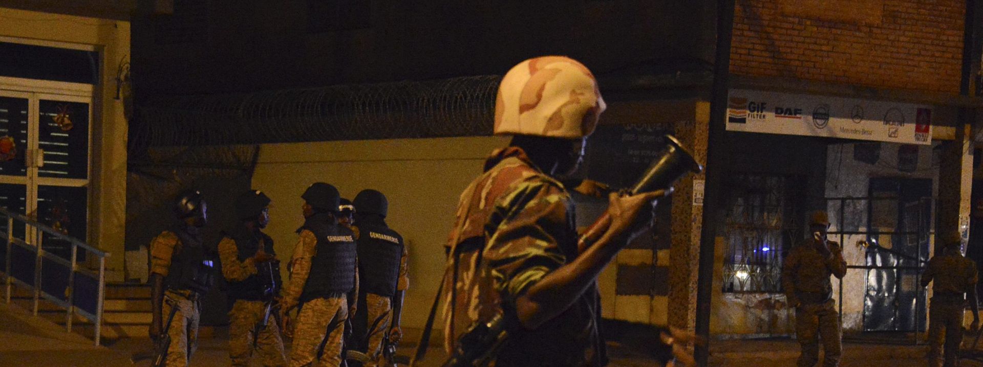 epa05104418 A soldier secures a street outside the Splendid Hotel in Ouagadougou, Burkina Faso, 15 January 2016. At least 20 people were killed on 15 January in a terrorist attack on a restaurant and hotel in the capital of the western African country of Burkina Faso. Several people have been injured, many critically, media reported. Heavily armed gunmen opened fire at a popular restaurant in Ouagadougou before taking an unknown number of hostages in a hotel frequented by Westerners Friday night. Gunfire and explosions rattled the business center of the capital around 7:30 pm (1930 GMT). The area around the hotel was sealed off and a curfew was imposed until 6 am.  EPA/STR