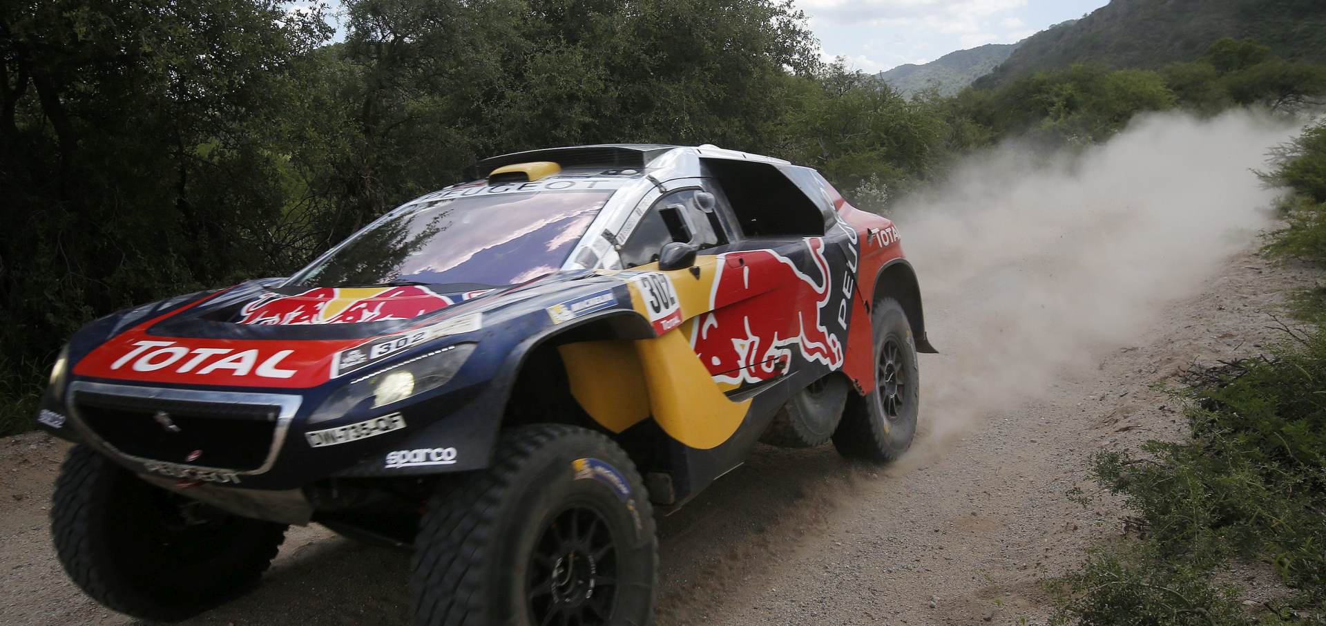 epa05103807 French Stephane Peterhansel, of Peugeot team, in action during the 12th stage of Rally Dakar 2016, between San Juan and Villa Carlos Paz localities, Argentina, 15 January 2016.  EPA/Felipe Trueba