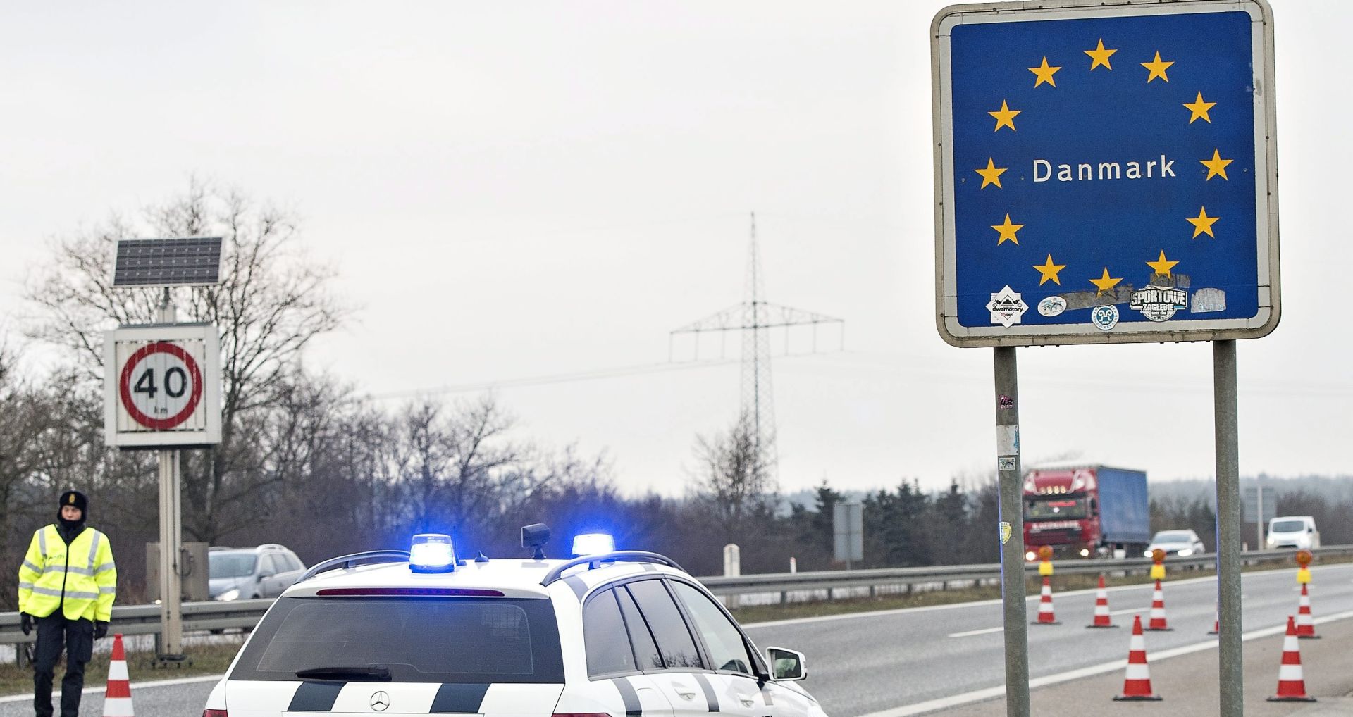 epa05087640 Danish police on patrol on highway E45 close to Padborg, Denmark, near the border with Germany, 04 January 2016. Denmark introduced temporary controls along its border with Germany, Danish Prime Minister Lars Lokke Rasmussen said, hours after Sweden introduced ID controls for travellers from Denmark. Since early September, 91,000 people have passed through Denmark from Germany, of whom 13,000 applied for asylum in Denmark.  EPA/CLAUS FISKER DENMARK OUT