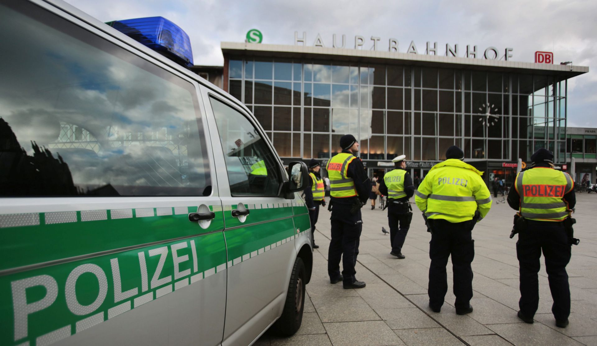 epa05098414 Members of the German police stand in front of the central railway station in Cologne, Germany, 12 January 2016. Groups of men that had engaged out of a crowd including some 1000 men had surrounded, sexually assaulted and mugged mainly women in the area surrounding Cologne's central railway station on New Year's Eve. A total of 553 police complaints - 45 per cent of them related to sexual violence - have been filed in Cologne, prompting politicians to call for increased security, the expulsion of criminal asylum seekers and the reduction of migrant flows going forward.  EPA/OLIVER BERG