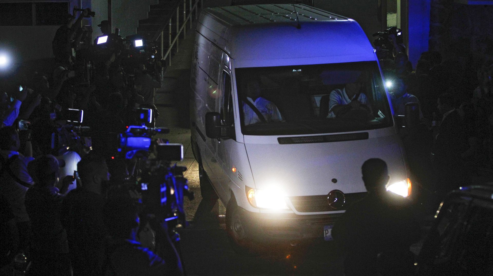 epa05136470 Photographers and cameramen are seen next to the vehicle that transfers the remains of deceased former Salvadoran former President Francisco Flores, accused of various corruption charges, at San Salvador, El Salvador, early 31 January 2016. Flores, 56, died on 30 January 2016, after 6 days in coma due to a clogged artery. Flores was president from 1999 to 2004 and was accused of misappropriation.  EPA/OSCAR RIVERA