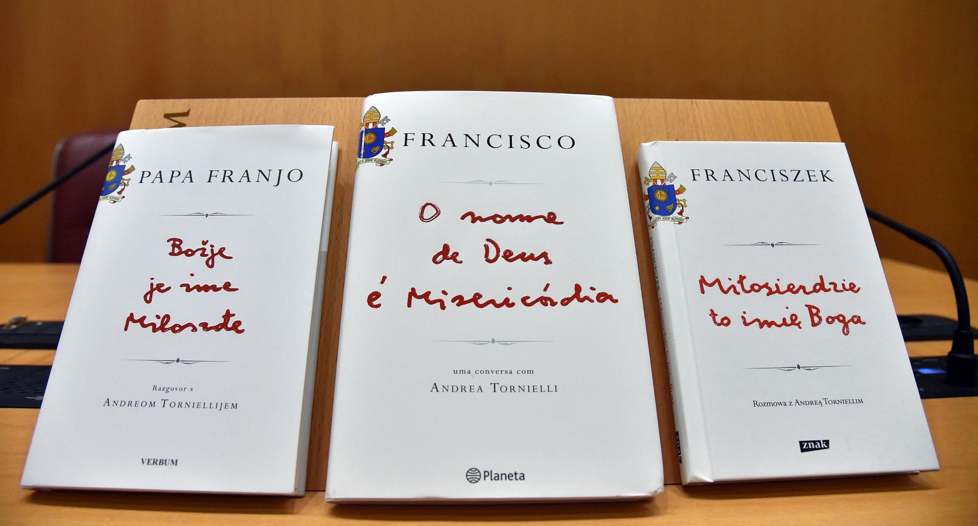 epa05098431 Copies of different editions of Pope Francis' book 'The Name of God Is Mercy' (Il nome di Dio e Misericordia) are on display ahead of its official launch in Rome, Italy, 12 January 2016. Pope Francis' first book as pontiff is a 100-page conversation with Italian journalist Andrea Tornielli.  EPA/ETTORE FERRARI