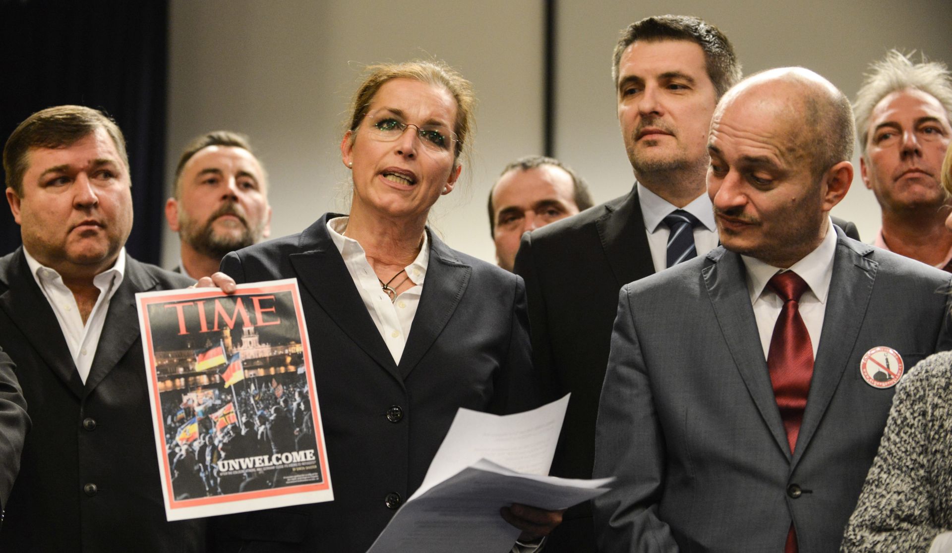 epa05120760 Tatjana Festerling (3-L), co-founder of German anti-immigration movement Pegida (Patriotic Europeans against the Islamization of the Occident), poses with a mopck magazine cover as she attends a meeting of xenophobic groups in Roztoky, near Prague, Czech Republic, 23 January 2016. Hosted by Czech right-wing populist party Usvit (Dawn - National Coalition), far-right populists from 14 countries met to coordinate their movements.  EPA/RENE VOLFIK