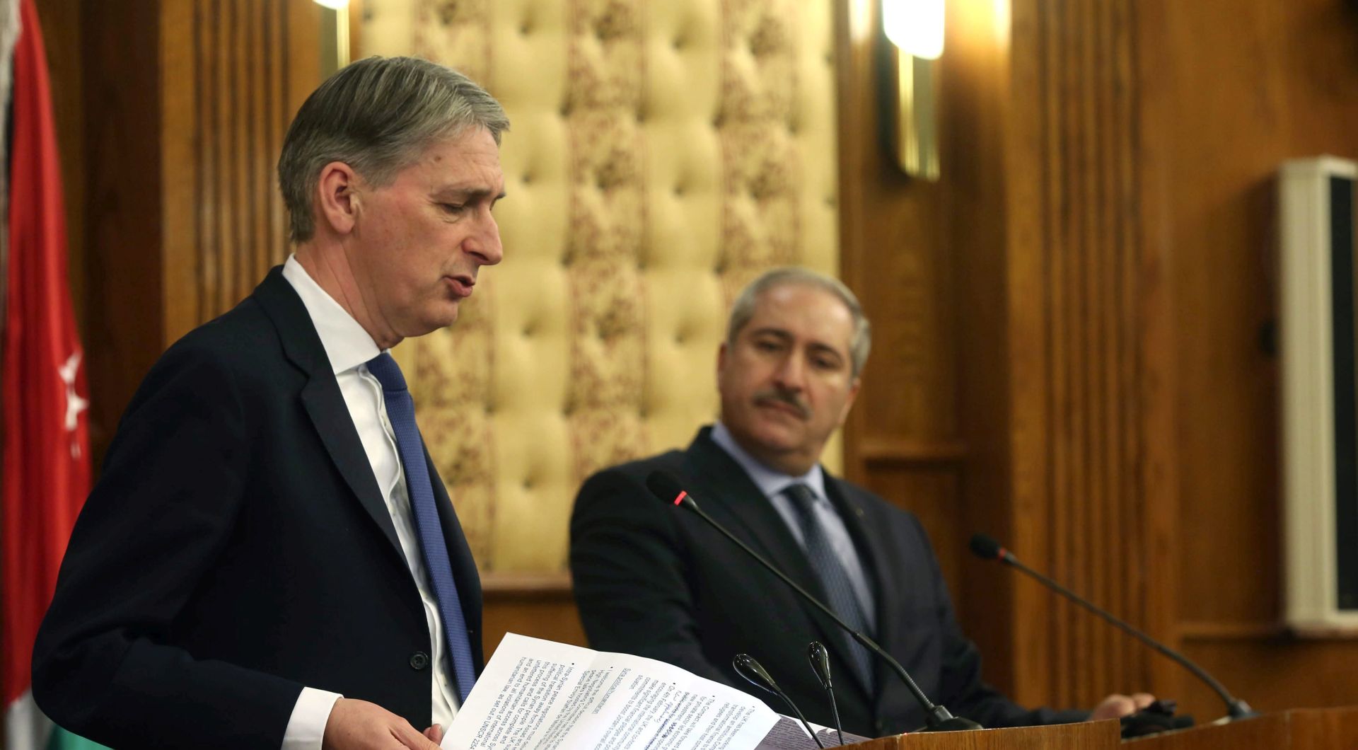 epa05138436 British Foreign Secretary Philip Hammond (L) speaks during a press conference with his Jordanian counterpart Nasser Judeh (R) in Amman, Jordan, 01 February 2016. Hammond is visiting Jordan ahead of a donor conference in London this week to discuss the refugee crisis and ways to support them and the host countries. Jordan is hosting over 1.2 million Syrian refugees.  EPA/JAMAL NASRALLAH