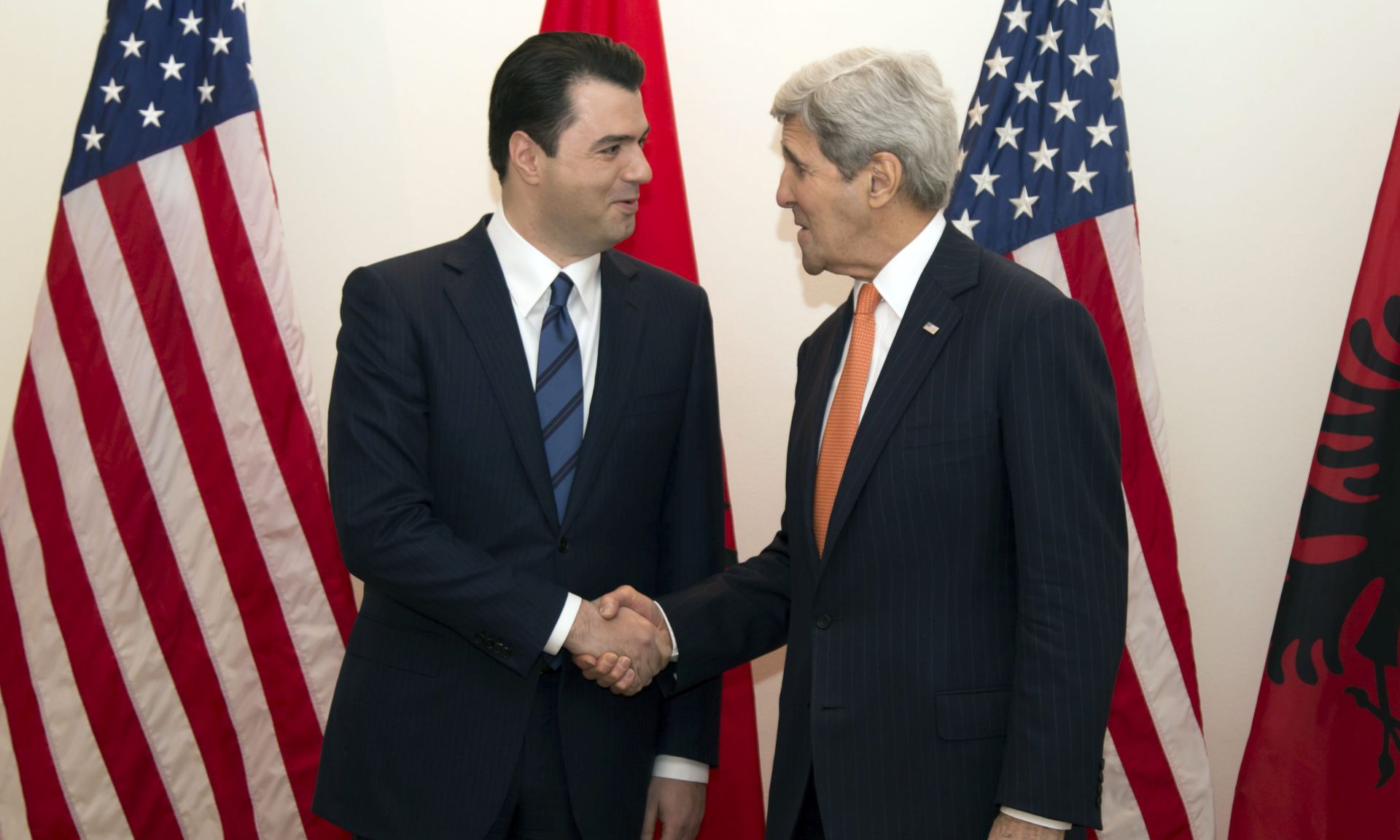 epa05160111 US Secretary of State John Kerry (R) and leader of Albanian opposition Party Lulzim Basha pose for photographers following their meeting in Tirana, Albania, 14 February 2016. US Secretary of State John Kerry arrived in Tirana for a one day official visit.  EPA/STR