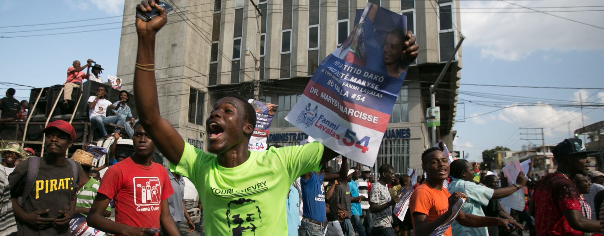 epa05148672 Supporters of the opposition demonstrate in the streets of Port-au-Prince on the day the current president, Michel Martelly, leaves power on the streets of Port Au Prince in Haiti, 7 February 2016.Martelly leaves the office on February 07 as per Haitian constitution. The ceremony took place in the parliament.  EPA/BAHARE KHODABANDE