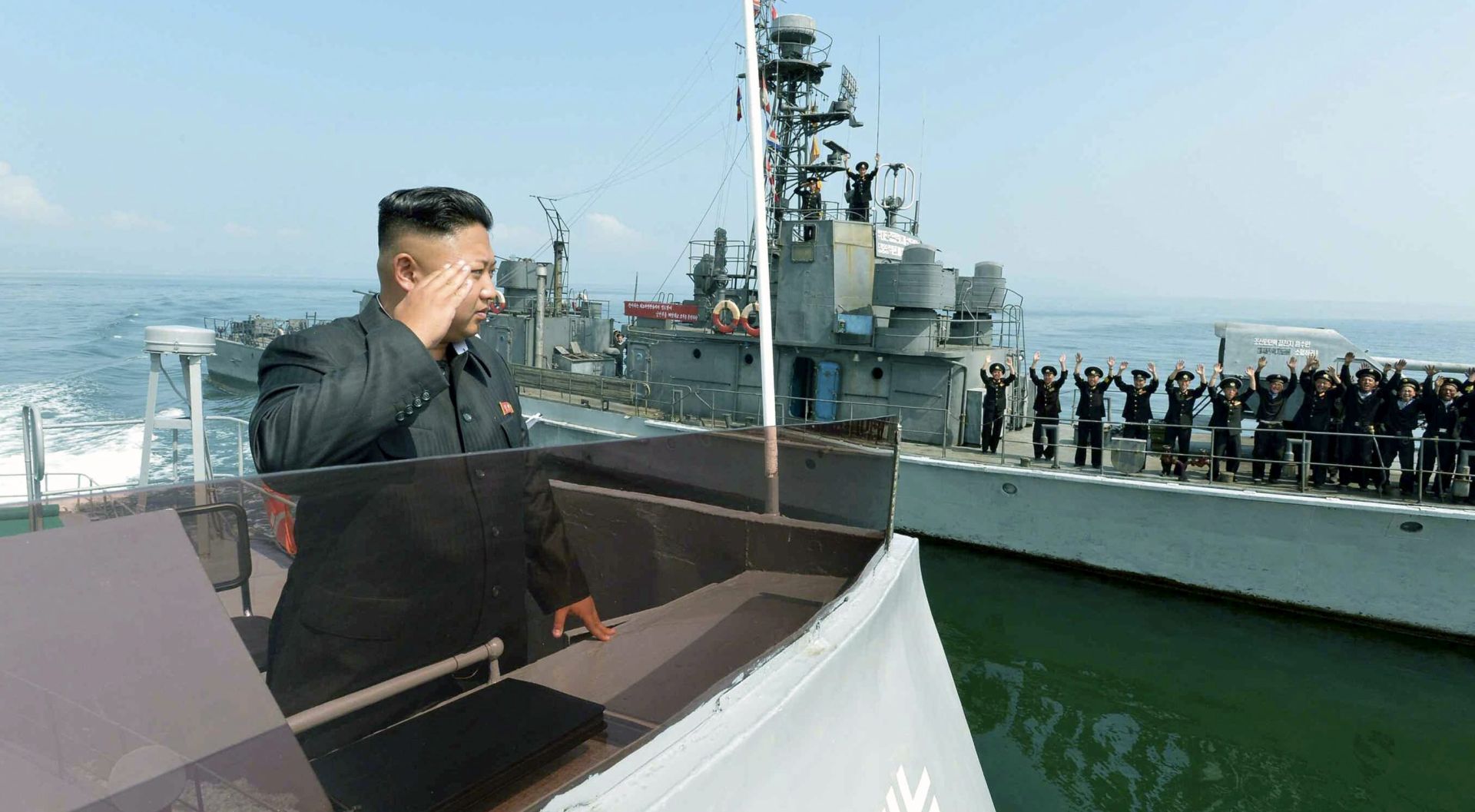 epa05149174 (FILE) An undated file picture released by the Rodong Sinmun, the newspaper of the ruling North Korean Workers Party, shows North Korean leader Kim Jong-un saluting to military servicemen on a Navy ship, somewhere in North Korean waters, after inspecting a military landing drill participated by the People's Army's ground, naval, air and anti-air forces. The South Korean military fired warning shots at a military vessel from the North that crossed their maritime border on 08 February 2016, media reported. The boat crossed the disputed boundary around 6:55 am (21:55 GMT on 07 February) in the Yellow Sea, to the west of the peninsula, before retreating 20 minutes later after the South's navy fired five warning rounds, an unnamed Seoul military official was quoted as saying by reports. North Korean vessels frequently cross the Northern Limit Line, which Pyongyang argues should be further south. Tensions are high between the two Koreas, which remain technically at war after the 1950-53 conflict ended in a ceasefire and remains without a peace treaty.  EPA/RODONG SINMUN SOUTH KOREA OUT