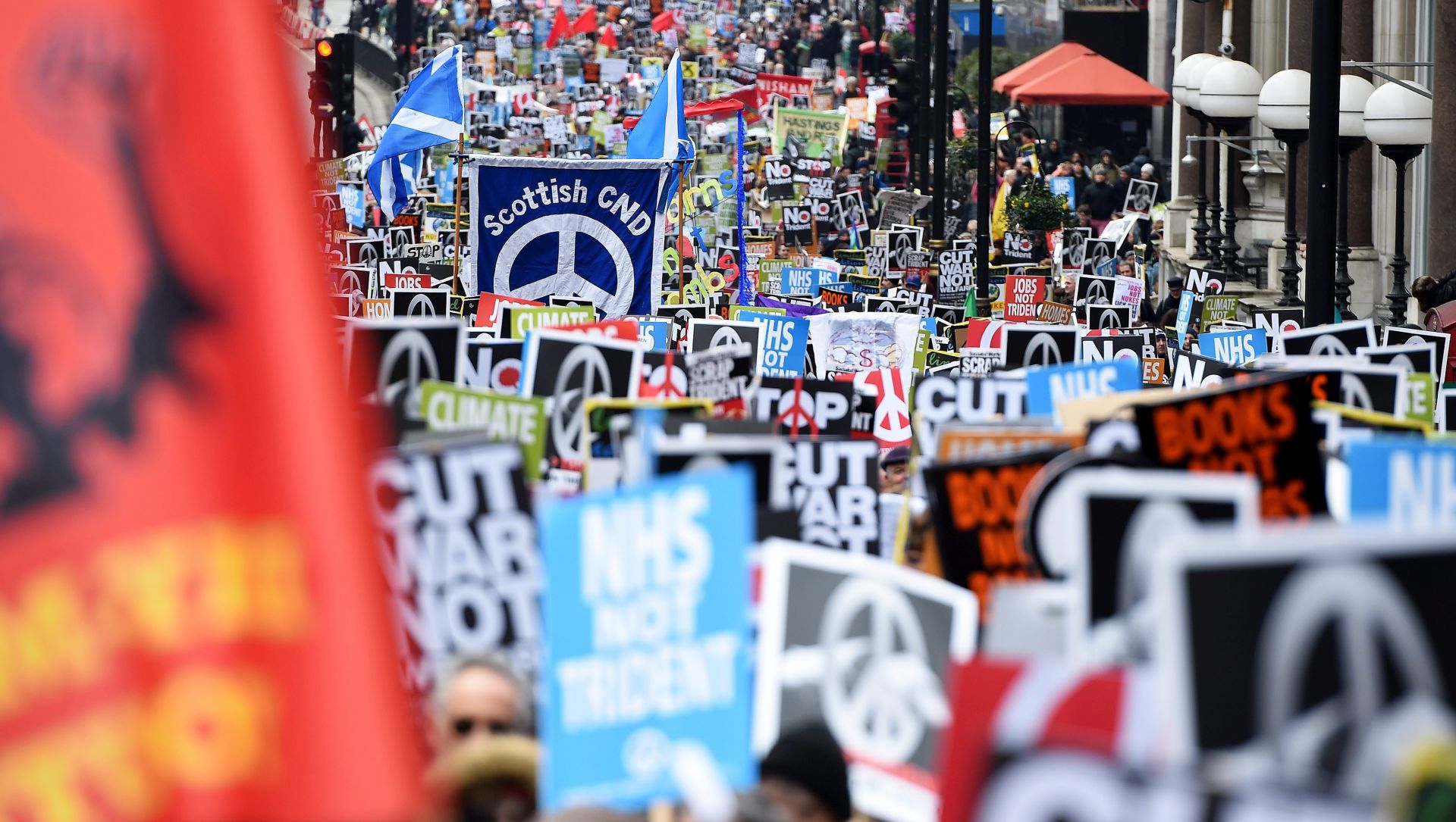 epa05183615 Anti-Trident demonstrators march during a protest organised by Campaign for Nuclear Disarmement (CND) titled 'Stop Trident' in London, Britain, 27 February 2016. Tens of thousands of people from all walks off life turned out to support the anti trident campaign.  EPA/ANDY RAIN