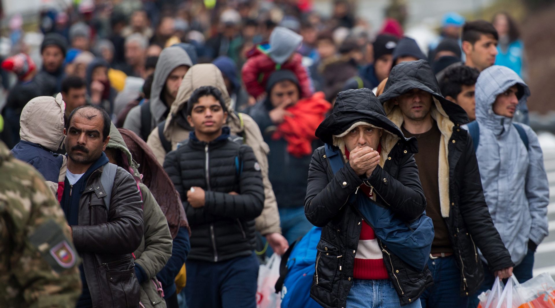 epa05164748 Refugees and migrants walk down a road to cross the Slovenian-Austrian border, near the village of Spielfeld, Sentilj, Slovenia, 16 February 2016.  Austria is making plans for the introduction of border controls at a dozen additional crossings in order to manage the inflow of migrants, Interior Minister Johanna Mikl-Leitner says. The border measures are to include checks on people, vehicles and trains, the Interior Ministry says about the controls that are to be modelled on recently introduced strict controls at the Slovenian-Austrian border at Spielfeld.  EPA/CHRISTIAN BRUNA