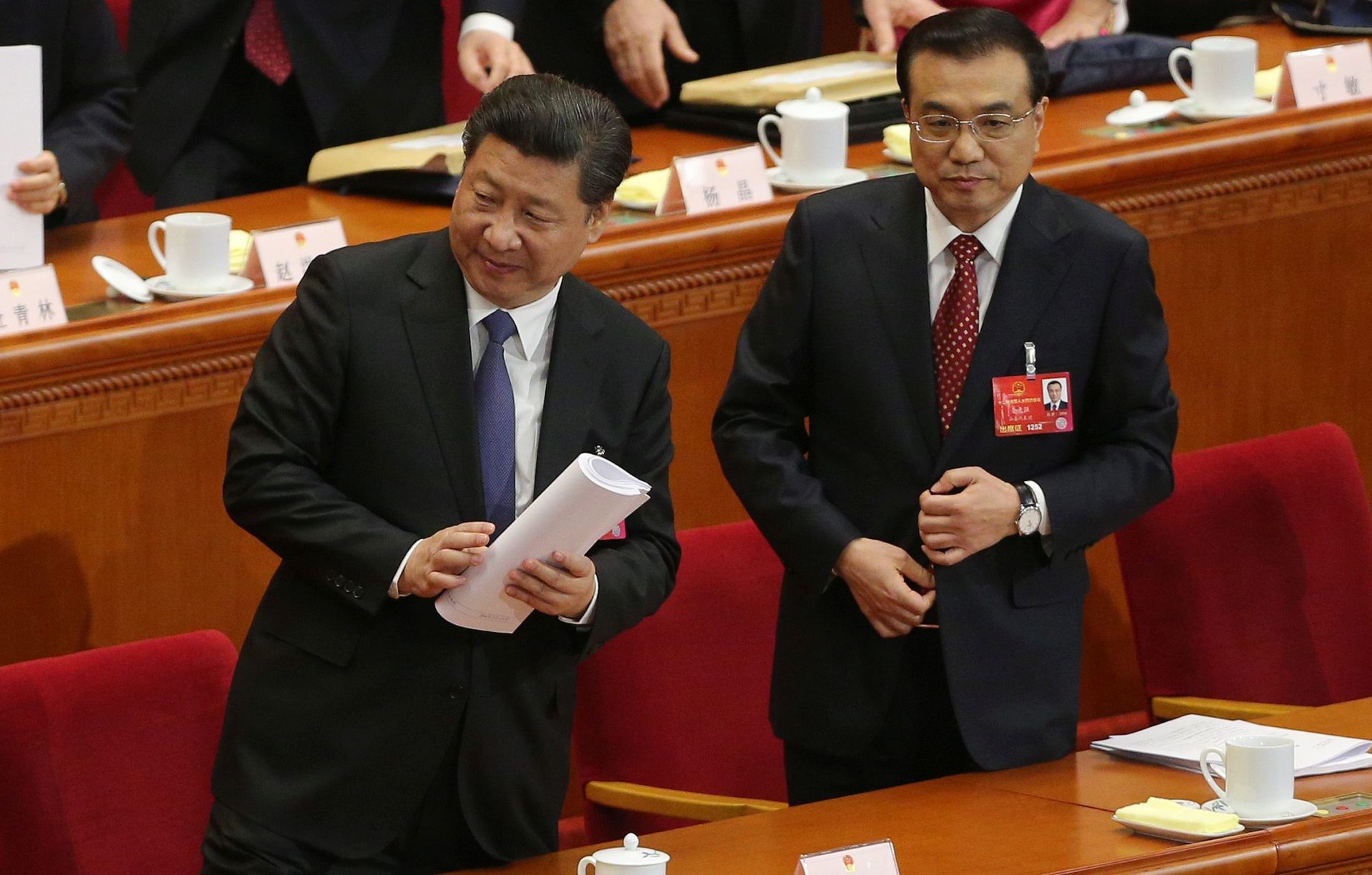 epa05195585 Chinese Premier Li Keqiang (R) and Chinese President Xi Jinping leave after the opening of the fourth Session of the 12th National People's Congress (NPC) at the Great Hall of the People in Beijing, China, 05 March 2016. The NPC has over 3,000 delegates and is the world's largest parliament or legislative assembly though its function is largely as a formal seal of approval for the policies fixed by the leaders of the Chinese Communist Party.  EPA/WU HONG