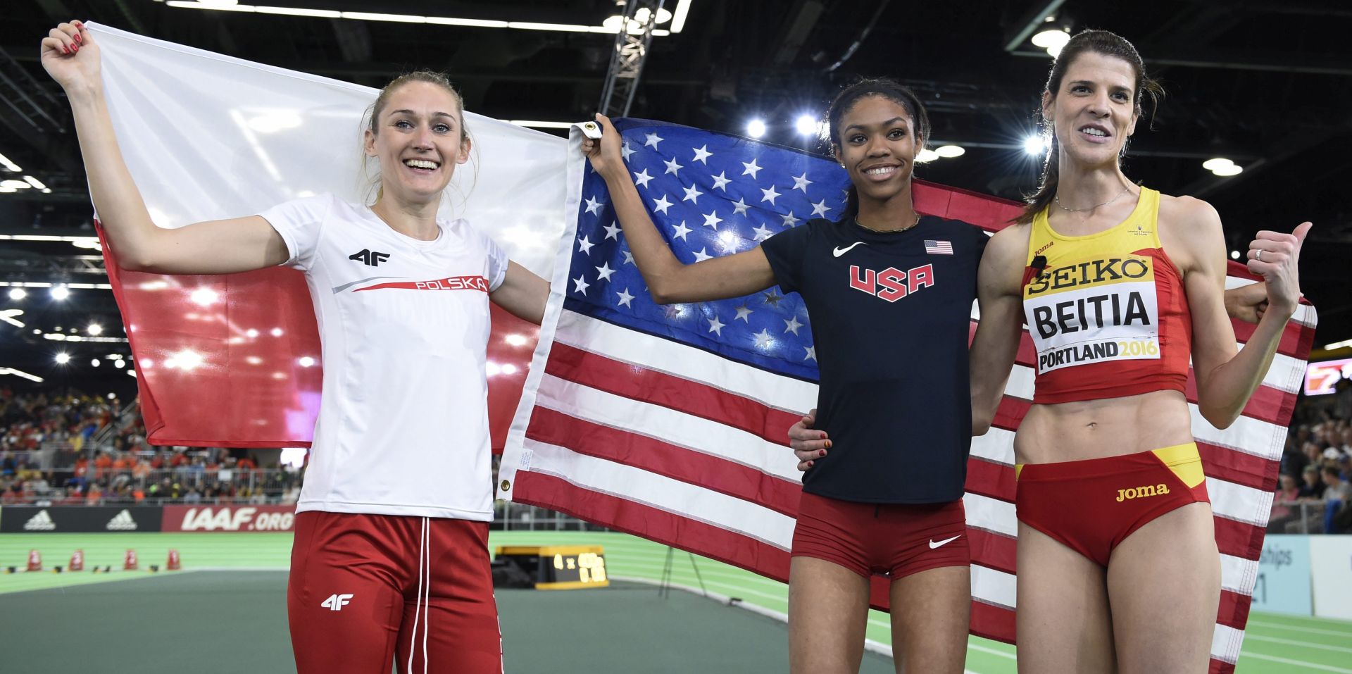 epa05223483 Vashti Cunningham of the USA (C) gold medal, Ruth Beitia of Spain (R) silver medal, and Kamila Licwinko of Poland (L) bronze medal pose for a group photo after the women's High Jump final at the IAAF World Indoor Championships in Portland, Oregon, USA, 20 March 2016.  EPA/JOHN G. MABANGLO