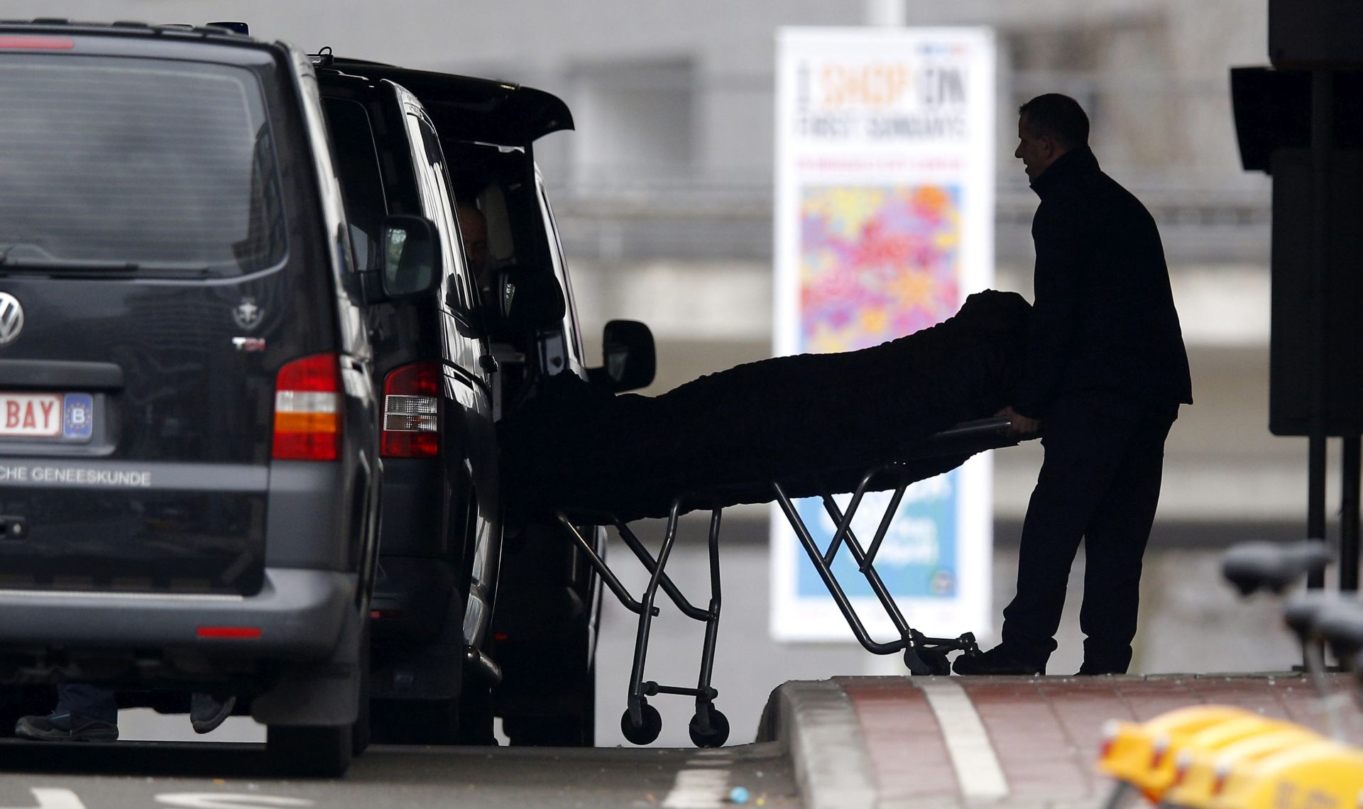 epaselect epa05226876 The body of a victim is removed from Maelbeek Metro station a day after multiple terrorist attacks, in Brussels, Belgium, 23 March 2016. Security services are on high alert following two explosions in the departure hall of Zaventem Airport and one at Maelbeek Metro station in Brussels. At least 31 people have been killed with hundreds injured in the terror attacks, which Islamic State (IS) has since claimed responsibility for.  EPA/YOAN VALAT