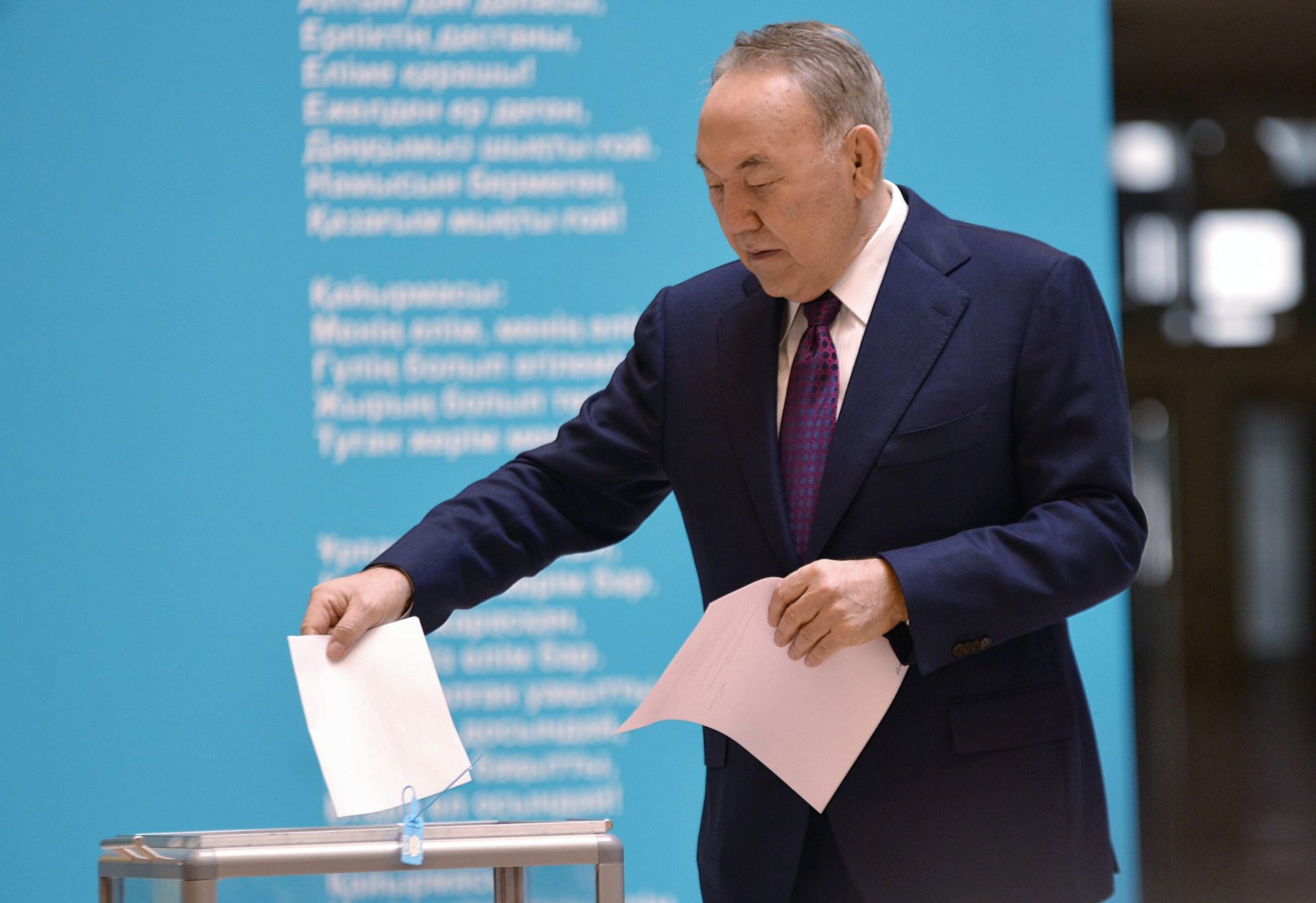 epa05221853 Kazakh President Nursultan Nazarbayev casts his vote during early parliament elections at a polling station in Astana, Kazakhstan, 20 March 2016. Polling stations across Kazakhstan opened as voters began casting their ballots for early legislative elections in this Central Asian nation. There are 234 hopefuls vying for 98 seats in the 107-seat lower house of Parliament, or Mazhilis, with the remaining nine seats designated by the Assembly of the People of Kazakhstan, a constitutional body made up of representatives from the nation's ethnic groups.  EPA/TURAR KAZANGAPOV