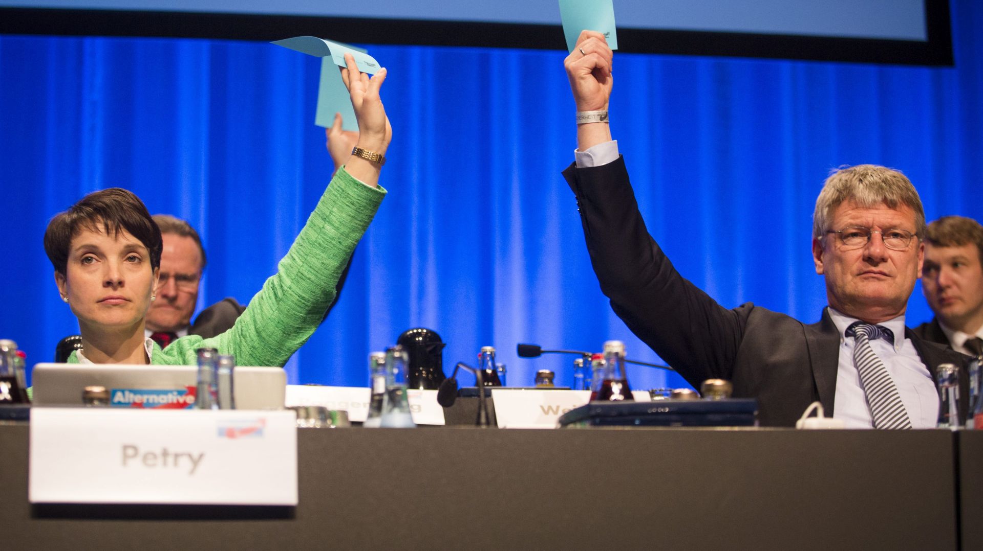 epa05283789 AfD party leader Frauke Petry (L) and chairman Joerg Meuthen (R) vote during the 5th party convention of the Alternative for Germany (AfD) in Stuttgart, Germany, 30 April 2016. Reports state that hundreds of left wing protestors demonstrated outside the venue with the aim of stopping people attending the conference. German right-wing anti-migration Alternative for Germany (AfD) has recently come under criticism for remarks about the Islam.  EPA/MARIJAN MURAT