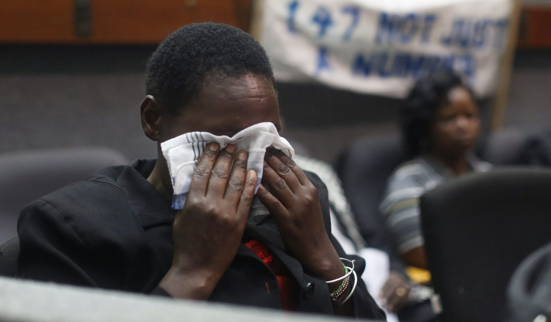 epa05241102 A family member of a victim reacts during a memorial service to mark the first anniversary of the terror attack on Garissa University College in Nairobi, Kenya, 02 April 2016. Gunmen from Somalia's Islamist militant group al-Shabab stormed the Garissa University College in Garissa town, close to the border with Somalia, on the morning of 02 April 2015, killing 148 people.  EPA/DAI KUROKAWA