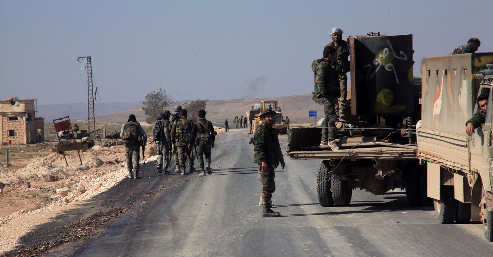 epa05187957 A handout picture made available by the Syrian Arab News Agency (SANA) shows Syrian Arab Army forces on Aleppo-Khanaser road in Aleppo province, Syria, 29 February 2016. Meanwhile, aid trucks arrived in Moadamiyet al-Sham in southern Syria on 29 February, taking advantage of a shaky ceasefire in the war-torn country that is now in its third day.  EPA/SANA / HANDOUT  HANDOUT EDITORIAL USE ONLY/NO SALES