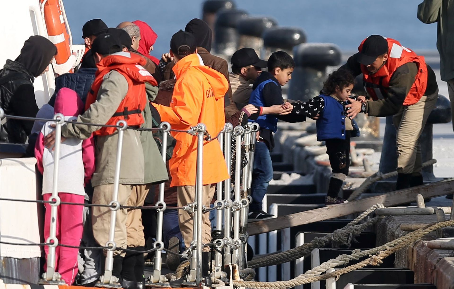 epa05245811 Migrants arrive in the Dikili harbor after they were caught by Turkish Coast Guard off the coast near Izmir, Turkey 06 April 2016. Migrants who refuse to apply for asylum are to be deported to Turkey, in accordance with a tit-for-tat agreement between the European Union (EU) and Turkey on the refugee and migration crisis.  EPA/TOLGA BOZOGLU