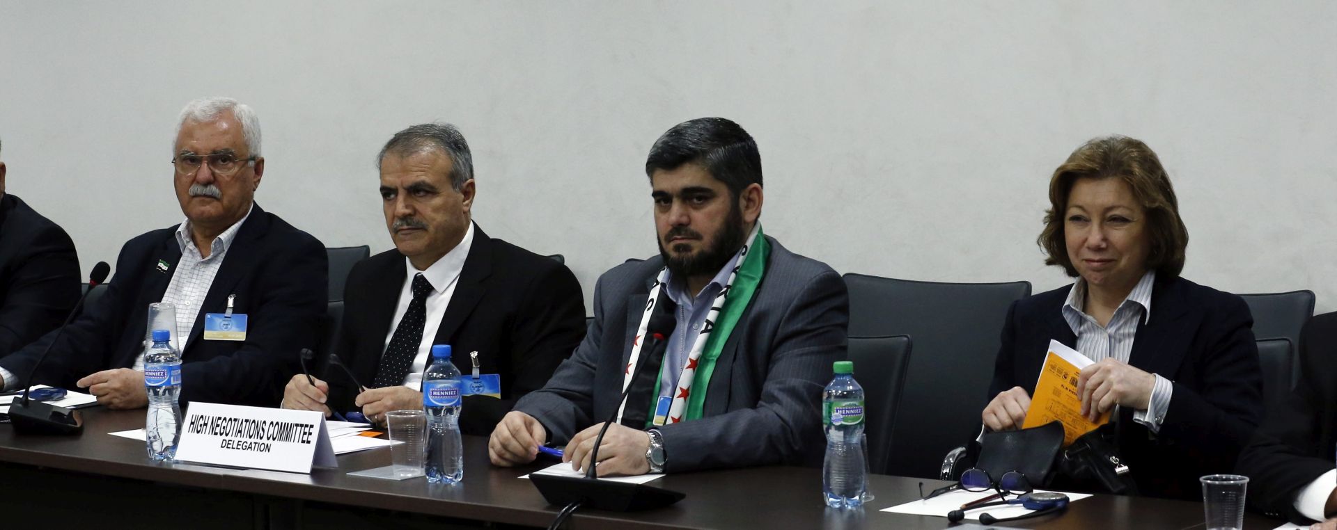 epa05225726 (L-R) Bassma Kodmani, Mohamed Alloush of the Jaysh al Islam, Asaad Al-Zoubi and George Sabra of the delegation of the High Negotiations Committee (HNC) during a meeting with a delegation of the High Negotiations Committee (HNC) and UN mediator Staffan de Mistura (unseen) as part of the Syria peace talks at the United Nations in Geneva, Switzerland, 22 March 2016.  EPA/DENIS BALIBOUSE / POOL