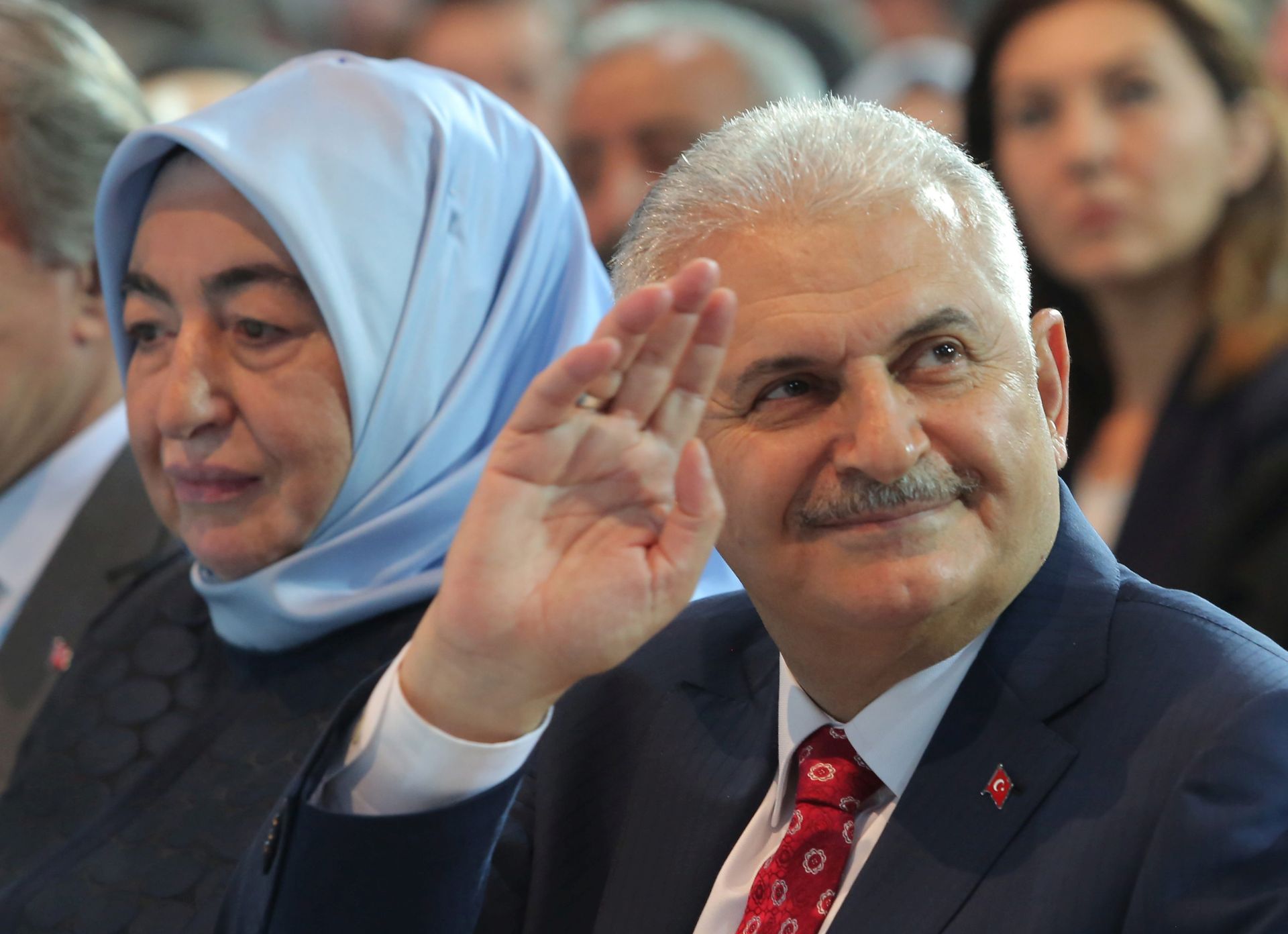 epa05322985 Turkey's Transportation Minister Binali Yildirim (R) and his wife Semiha (L)attend the Extraordinary Congress of the ruling Justice and Development Party (AKP) to choose the new leader of the party in Ankara, Turkey, 22 May 2016. Binali Yildirim was named on 19 May as the sole candidate to head Turkey's ruling Justice and Development, or AKP, party to succeed Ahmet Davutoglu, who resigned as prime minister.  EPA/RIZA OZEL / POOL