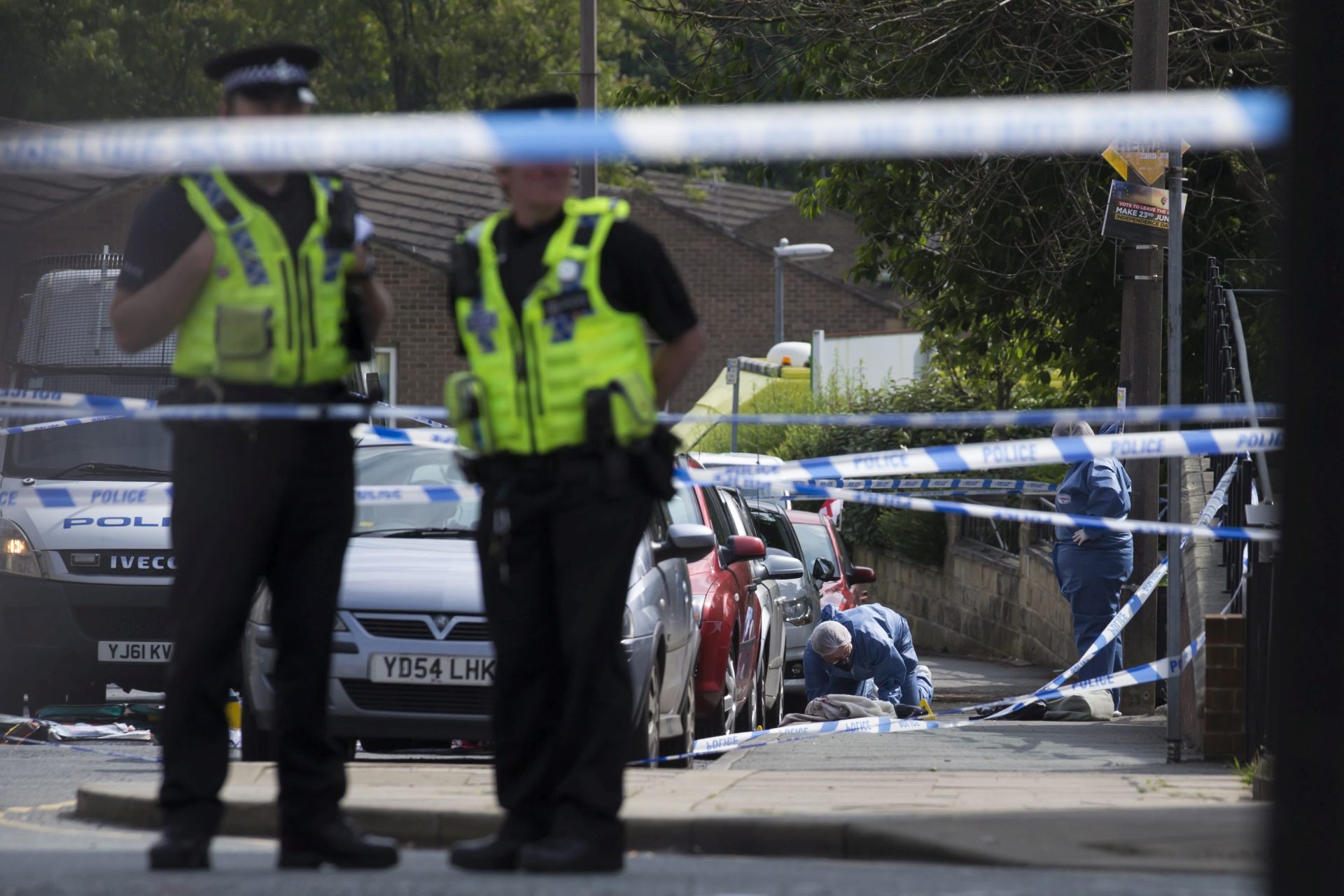 epa05369941 A general view showing police officers and crime scene investigators at the scene where British MP Jo Cox is reported to be critically injured amid shooting reports, in Birstall, Britain, 16 June 2016. A 52-year-old man has been arrested following the attack, Jo Cox is reported to have been airlfted to a hospital in Leeds where she's receiving treatments. Cox has in recent weeks campaigned for the Remain camp. The Brits will vote on whether they want remain in the EU on 23 June.  EPA/JON SUPER