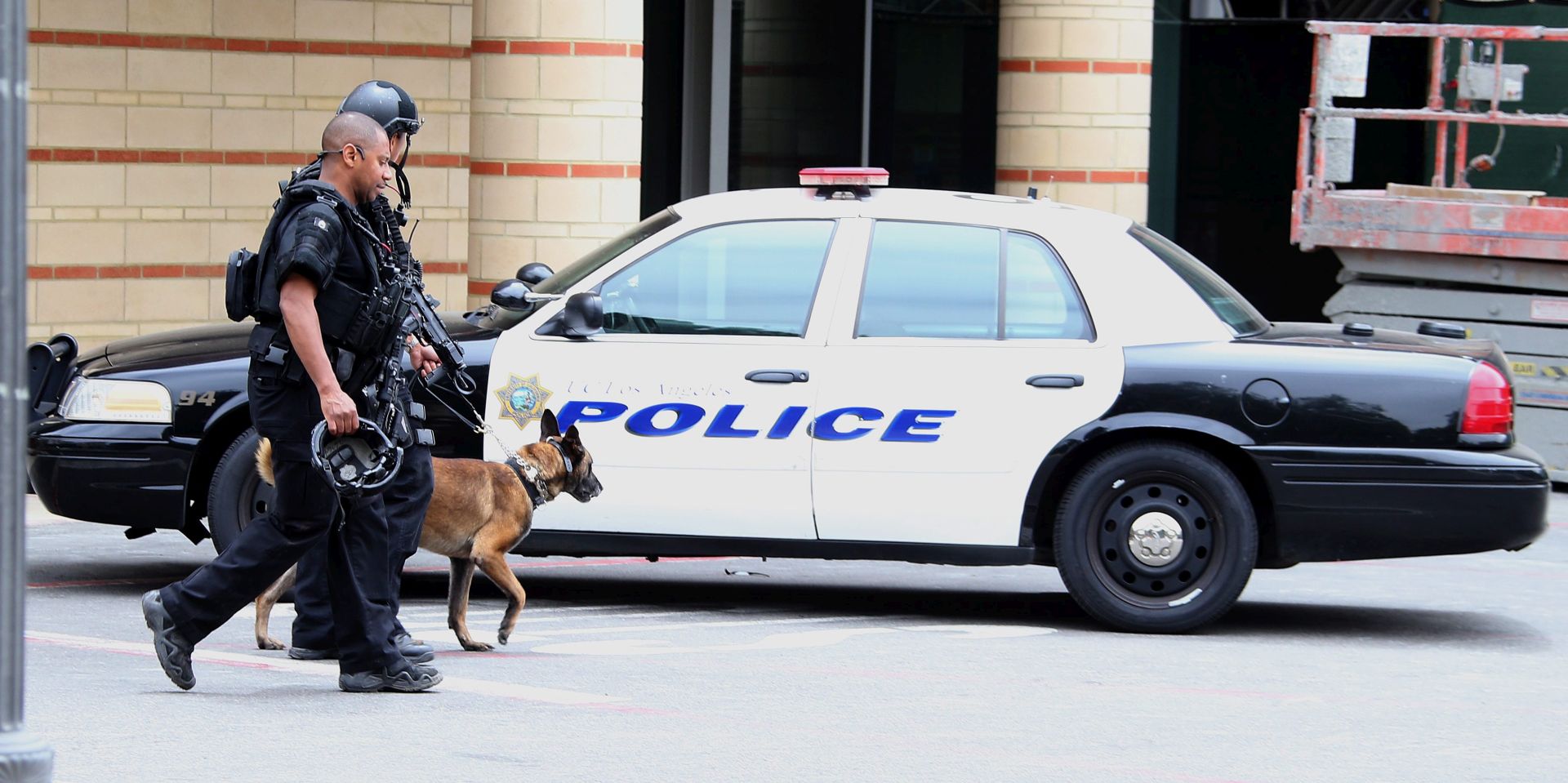 epa05341039 A canine police unit leaves the area near an engineering building where a shooting  was reported  on the University of California at Los Angeles campus  in  Los Angeles, California,  USA, 01 June 2016.  Latest reports indicated two people were killed and law enforcement is treating the incident as a murder-suicide situation.  EPA/MIKE NELSON