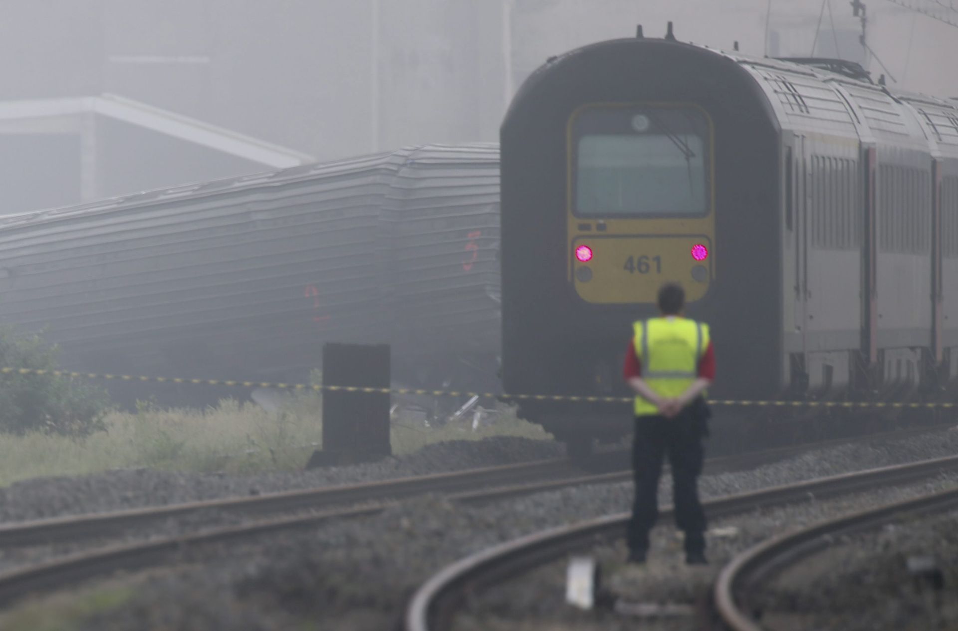 epa05348100 A general view shows the rescue operation at a site where two trains crashed in Hermalle-sous-Huy, Belgium, 06 June 2016. According to media reports, a passenger train crashed into the back of a goods train, causing at least three casualties and at least 30 injuries.  EPA/OLIVIER HOSLET