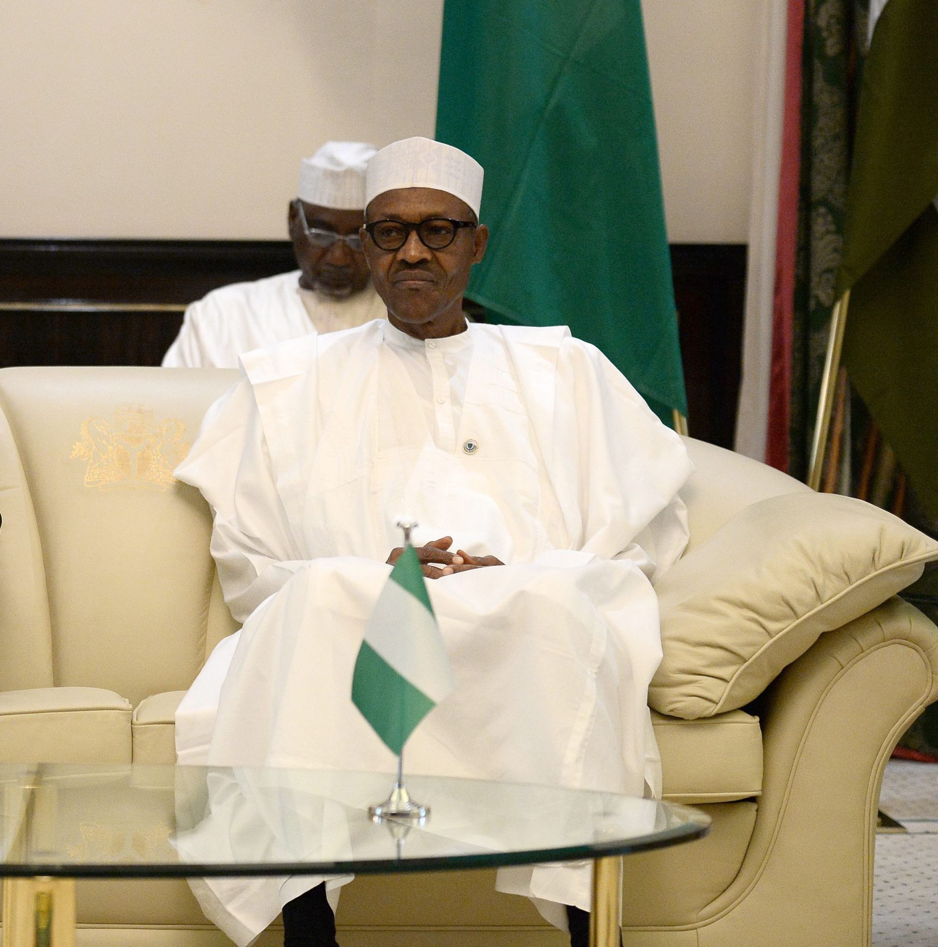 epa05305734 Nigerian President Muhammadu Buhari (R) and French President Francois Hollande (L) speak during a meeting at the presidential Palace in Abuja, Nigeria, 14 May 2016. Regional and Western powers gathered in Nigeria for talks on quelling the threat from Boko Haram as the UN warned of the militants' threat to African security and ties to the Islamic State group.  EPA/STEPHANE DE SAKUTIN / POOL MAXPPP OUT
