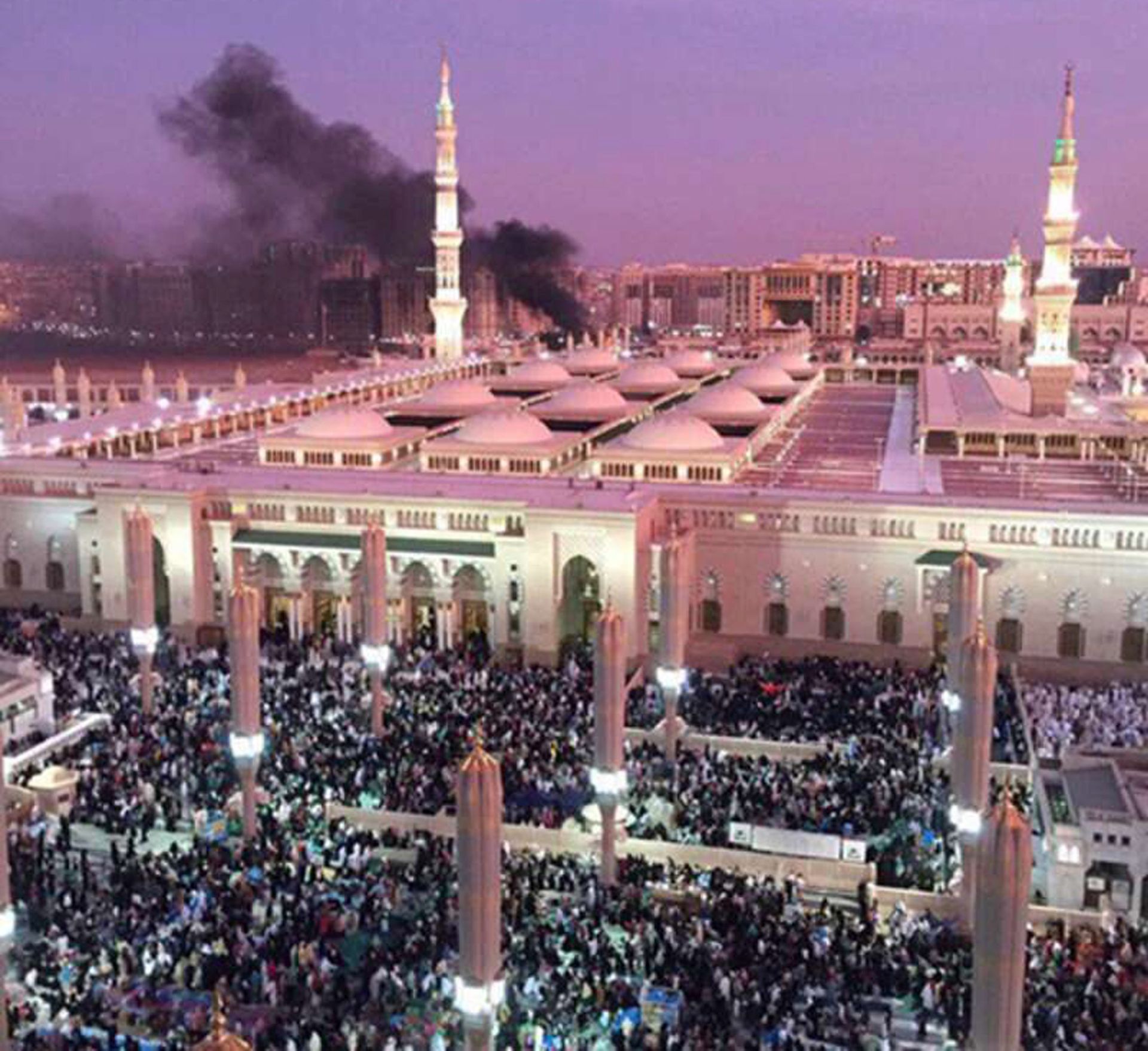 epa05407976 A handout photograph made available by the Saudi Press Agency (SPA) on 04 July 2016 shows the Prophet Mohammed Mosque with smoke rising in the background in the holy city of Medina, in Saudi Arabia, 04 July 2016. Media reports state that an apparent suicide bomber detonated a device at the second holiest site in Islam. Other explosions were also reported from sites in Jeddah and Qatif earlier the same day, which is the last day of the Muslim's Holy Month of Ramadan.  EPA/SAUDI PRESS AGENCY / HANDOUT HANDOUT EDITORIAL USE ONLY/NO SALES HANDOUT EDITORIAL USE ONLY/NO SALES