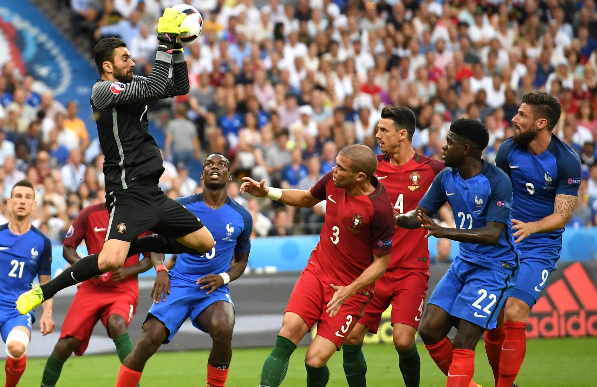 epa05419219 Goalkeeper Rui Patricio (L) of Portugal in action during the UEFA EURO 2016 Final match between Portugal and France at Stade de France in Saint-Denis, France, 10 July 2016.


(RESTRICTIONS APPLY: For editorial news reporting purposes only. Not used for commercial or marketing purposes without prior written approval of UEFA. Images must appear as still images and must not emulate match action video footage. Photographs published in online publications (whether via the Internet or otherwise) shall have an interval of at least 20 seconds between the posting.)  EPA/GEORGI LICOVSKI    EDITORIAL USE ONLY  EDITORIAL USE ONLY
