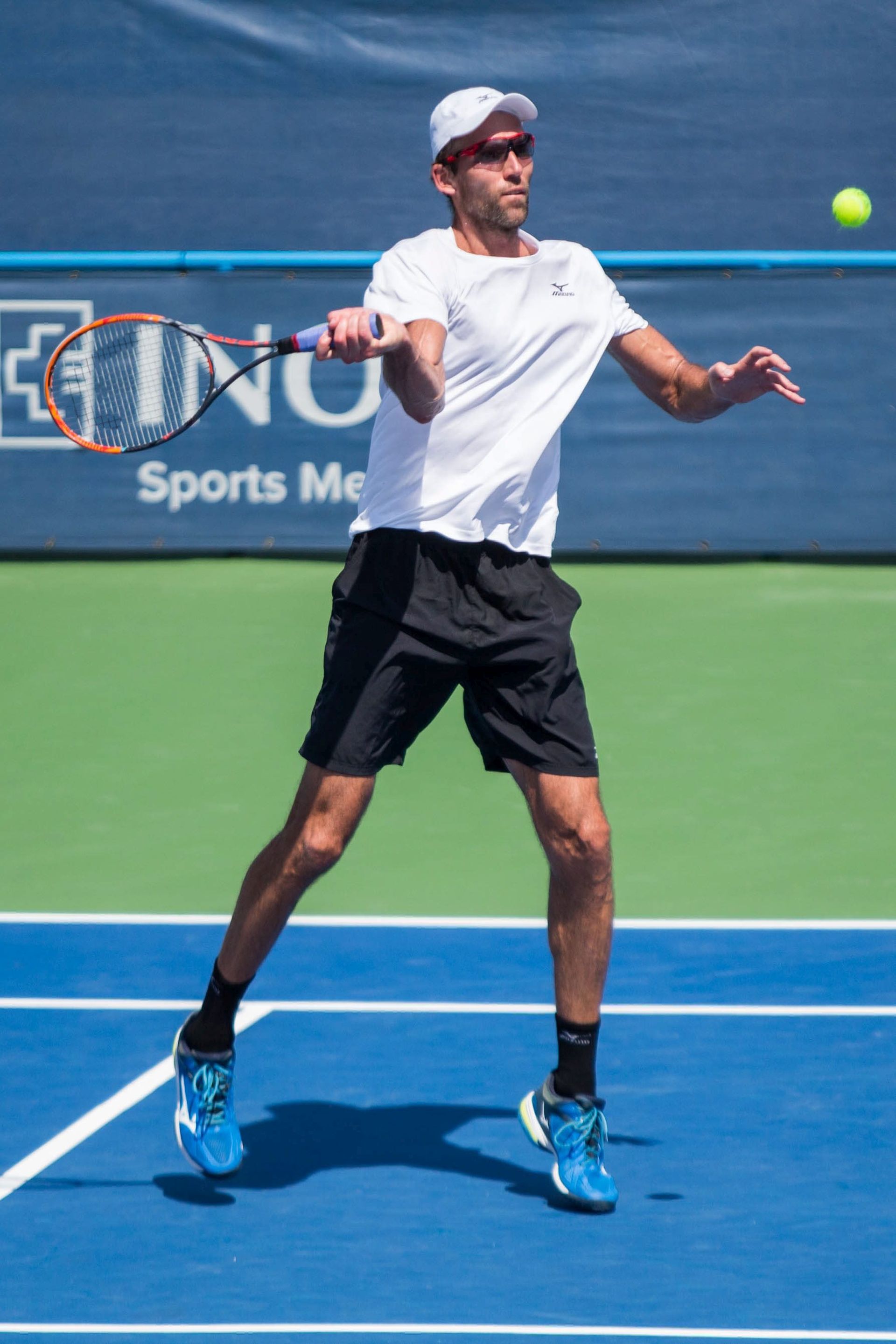 epa05438484 Ivo Karlovic of Croatia in action against Steve Johnson of the USA during their semifinal match of the Citi Open tennis tournament, at Rock Creek Park Tennis Center in Washington, DC, USA, 23 July 2016.  EPA/ZACH GIBSON