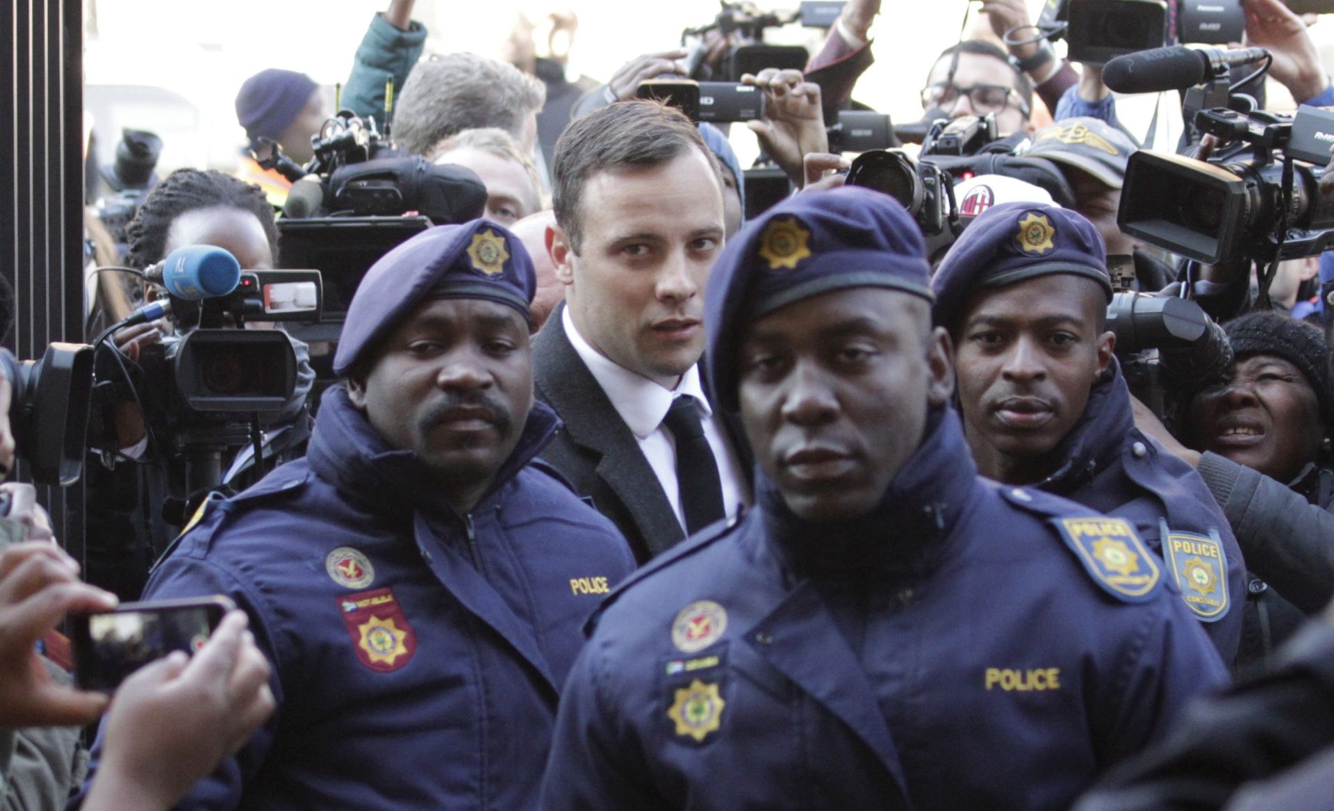 epa05409874 epa05409867 South African Paralympian Oscar Pistorius (C-R) arrives at the North Gauteng High Court in Pretoria for his sentencing for murder charges, Pretoria, South Africa, 06 July 2016.  The Supreme Court of South Africa overturned the High Court's verdict in December 2015, with South African Paralympian Oscar Pistorius now facing sentencing for murder of his girlfriend Reeva Steenkamp on 14 February 2013.  EPA/CORNELL TUKIRI  EPA/CORNELL TUKIRI ALTERNATIVE CROP