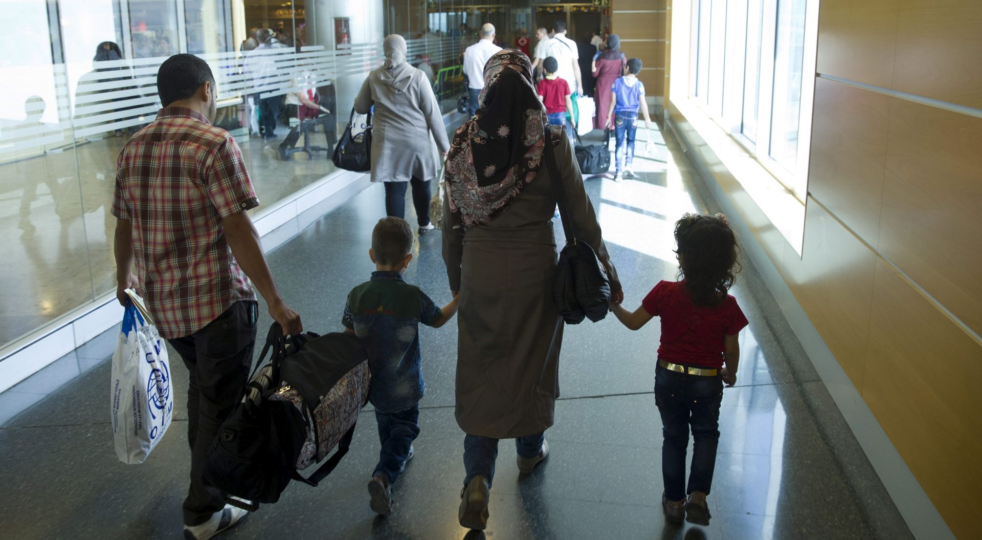 epa05396186 A handout picture provided by the Spanish Ministry of the Interior on 28 June 2016 shows part of a group of 33 Syrian refugees upon their arrival to Madrid from Lebanon at the Adolfo Suarez-Barajas international airport, in Madrid, Spain, 28 June 2016. The Syrian refugees arrived to Madrid from Lebanon as part of the resettlement program that has already received a total of 271 asylum seekers since the end of 2015.  EPA/SPANISCH INTERIOR MINISTRY/HANDOUT  HANDOUT EDITORIAL USE ONLY/NO SALES