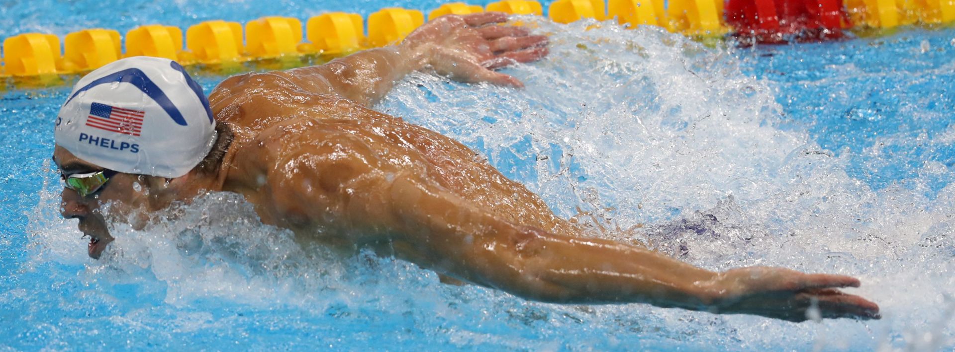 epa05474415 Michael Phelps of the US competes in the men's 100m Butterfly heats of the Rio 2016 Olympic Games Swimming events at Olympic Aquatics Stadium at the Olympic Park in Rio de Janeiro, Brazil, 11 August 2016.  EPA/ESTEBAN BIBA